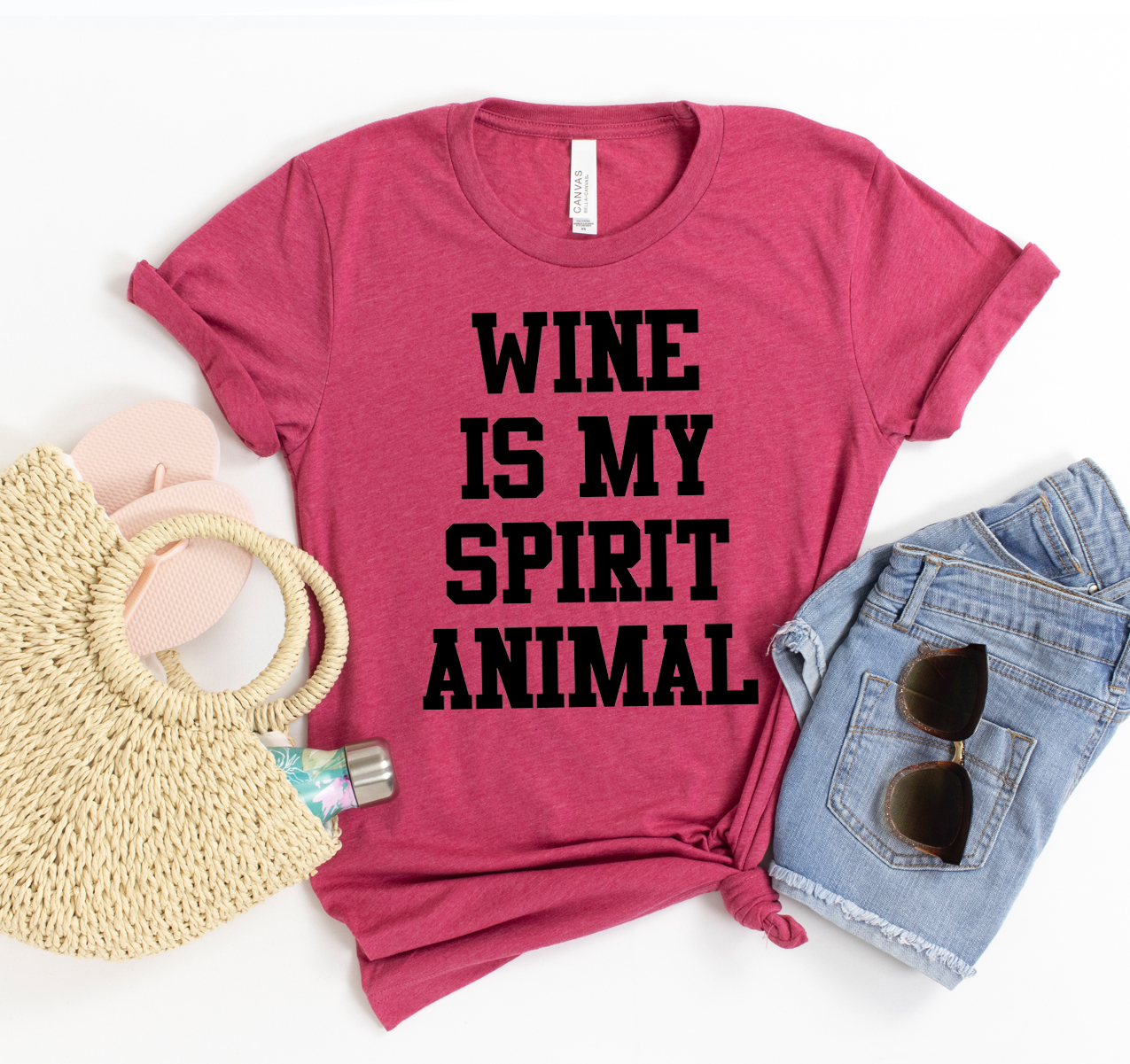 A stylish unisex T-shirt featuring the phrase 'Wine is My Spirit Animal' in a fun font, made from soft cotton fabric.