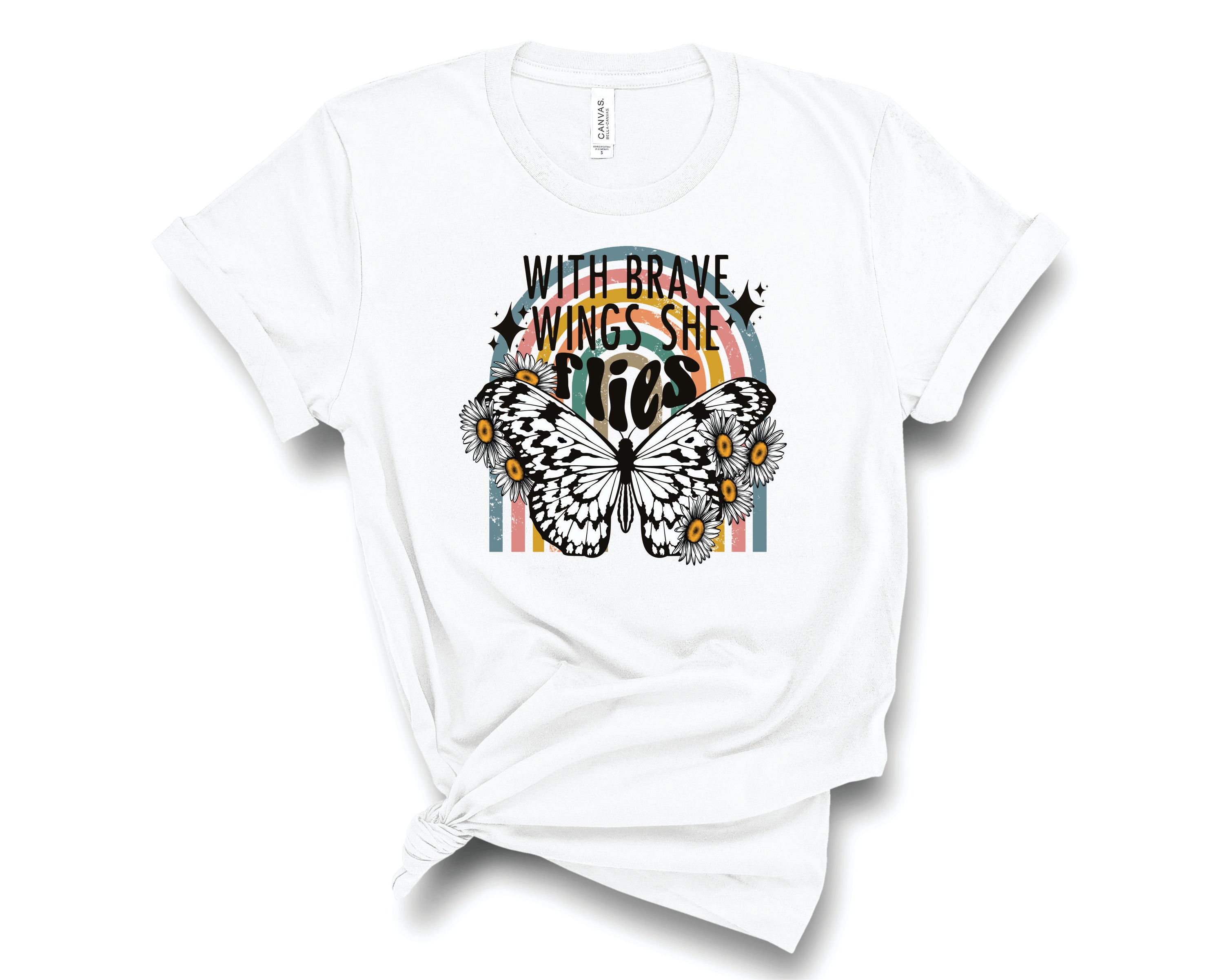 A unisex graphic tee featuring the phrase 'With Brave Wings She Flies' in an inspiring design, perfect for casual wear.