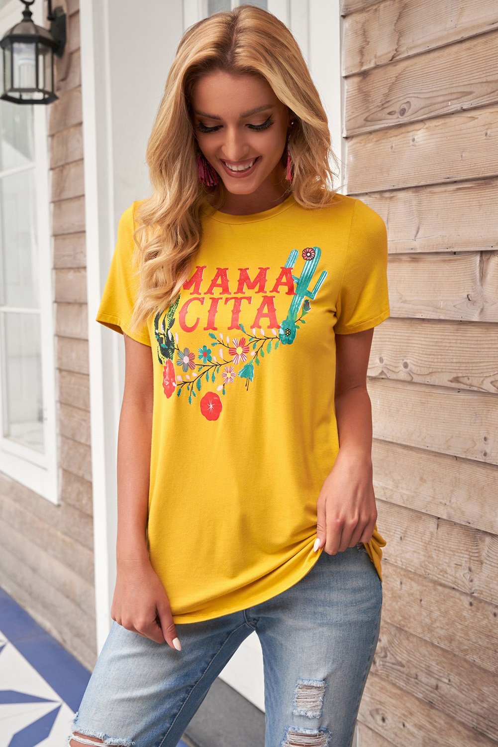 Women wearing a yellow Mamacita casual tee with cactus print, showcasing a stylish summer look.
