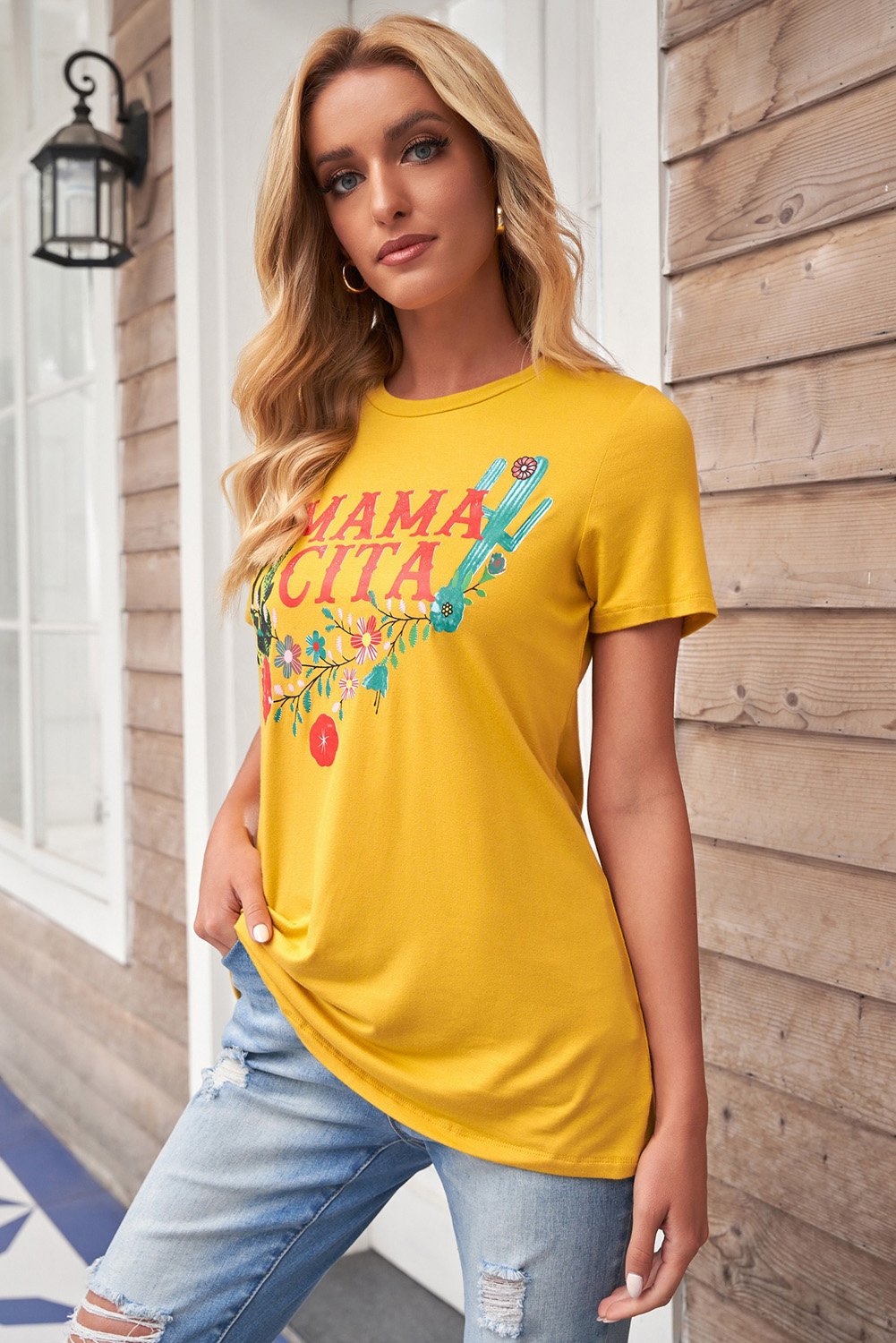 Women wearing a yellow Mamacita casual tee with cactus print, showcasing a stylish summer look.