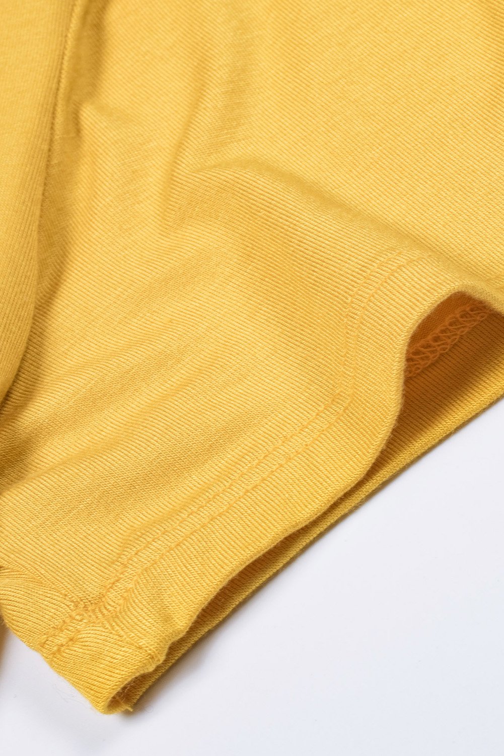 Women wearing a yellow Mamacita casual tee with cactus print, showcasing a stylish summer look.