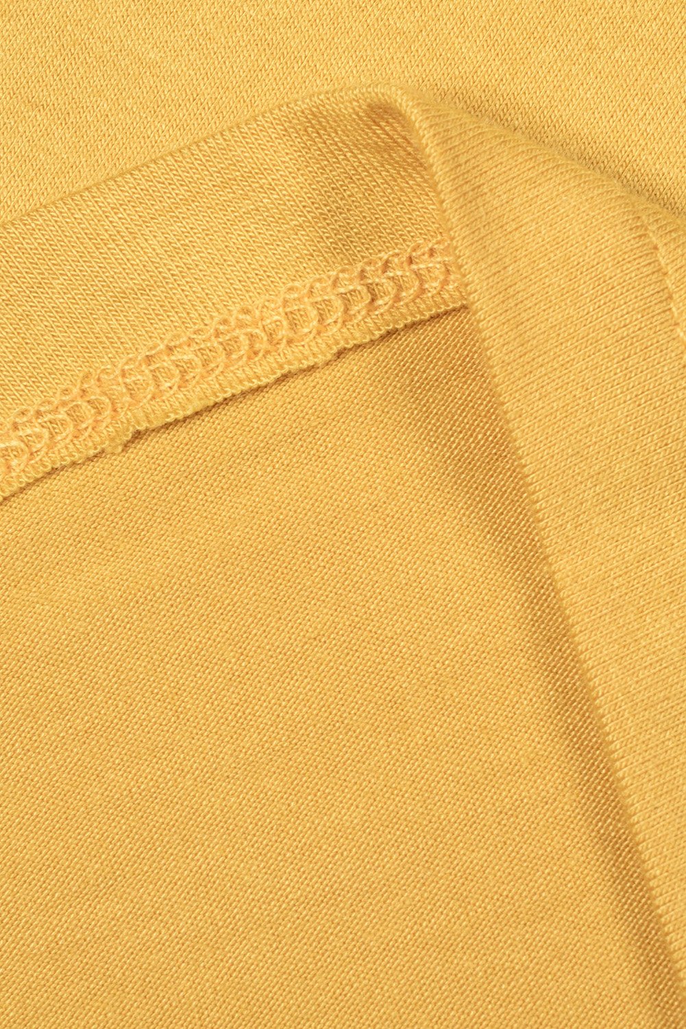 Women wearing a yellow Mamacita casual tee with cactus print, showcasing a stylish summer look.