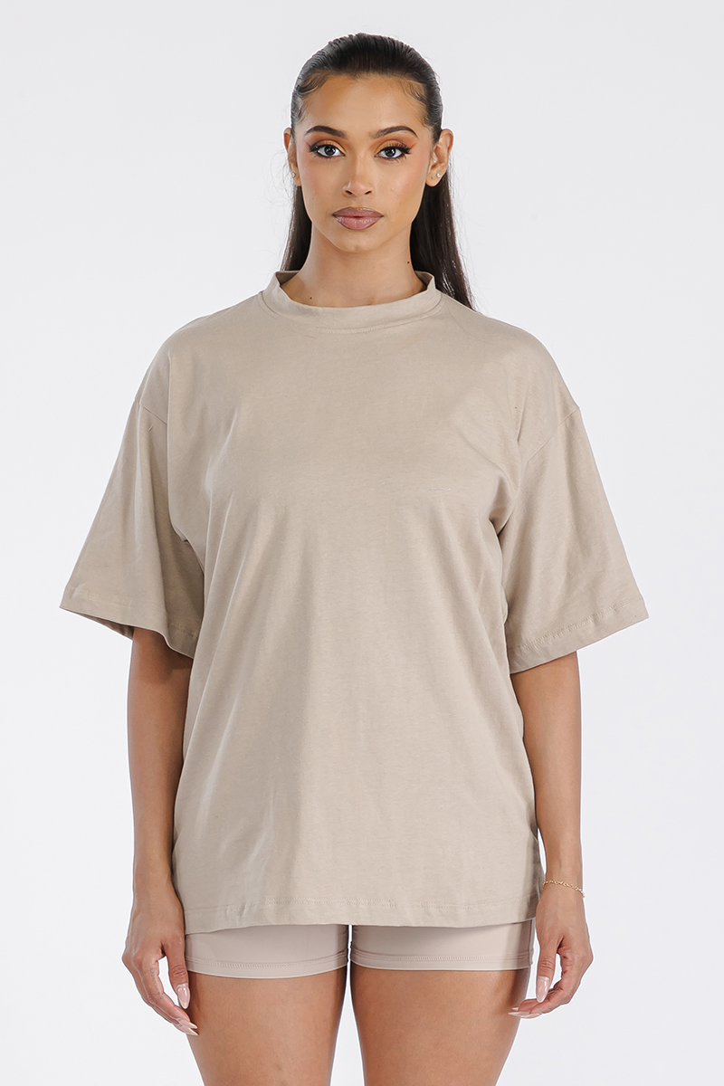 A stylish Women's Boyfriend Oversized Drop Shoulder Tee in soft cotton, showcasing its relaxed fit and round neck design.