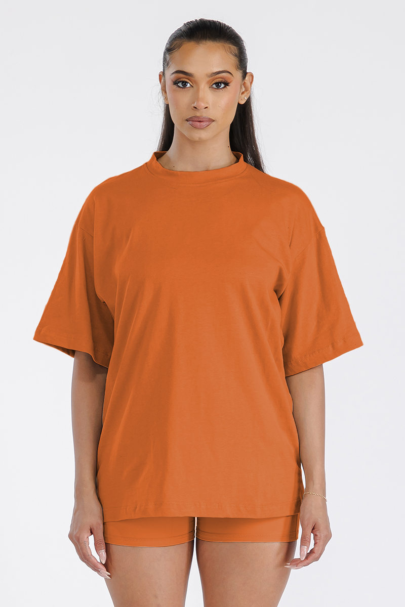 A stylish Women's Boyfriend Oversized Drop Shoulder Tee in soft cotton, showcasing its relaxed fit and round neck design.