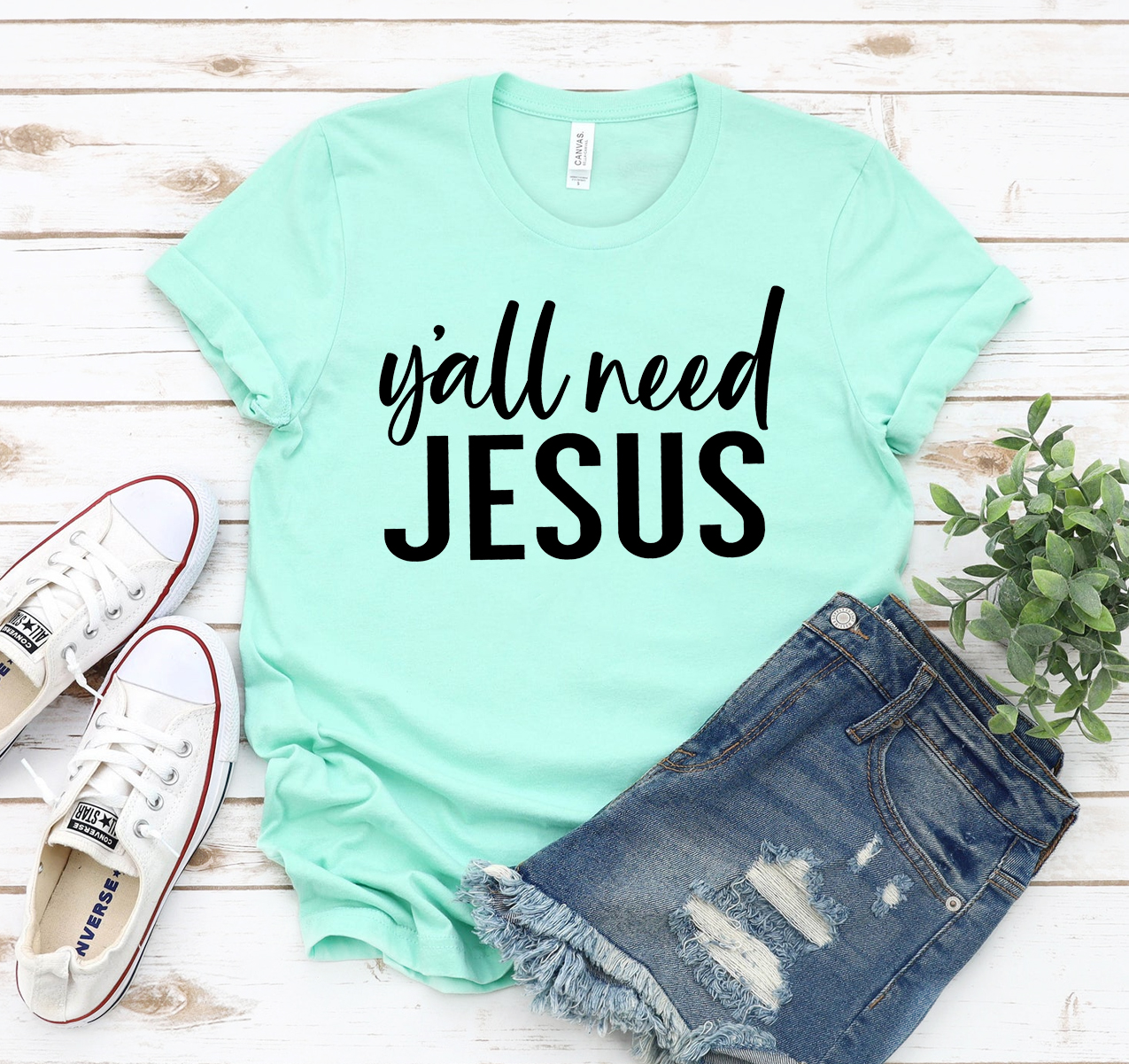 Y'all Need Jesus T-shirt in various sizes, showcasing its unisex design and soft fabric.