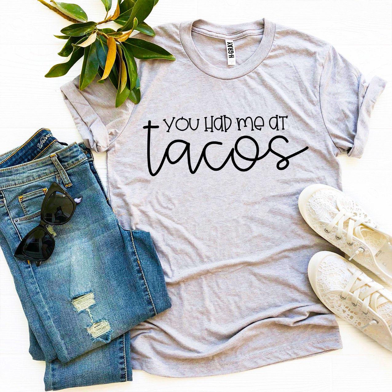 A stylish 'You Had Me At Tacos' T-shirt made from premium ring spun cotton, featuring a vibrant taco-themed print.