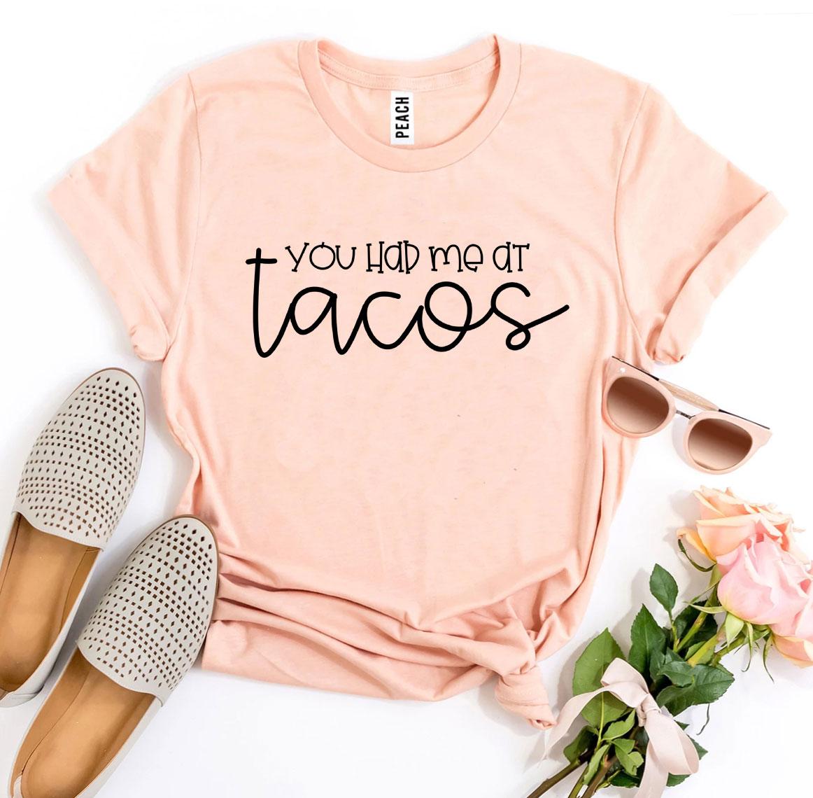 A stylish 'You Had Me At Tacos' T-shirt made from premium ring spun cotton, featuring a vibrant taco-themed print.