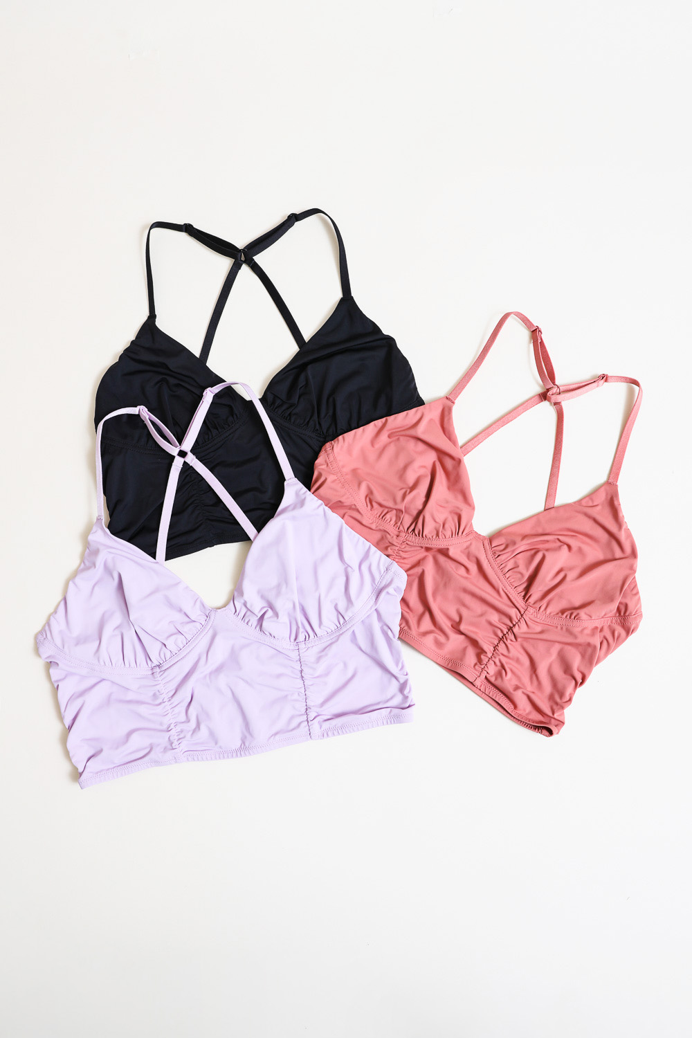 A stylish plus size ruched bralette made from soft nylon and spandex, featuring a comfortable fit and elegant design.