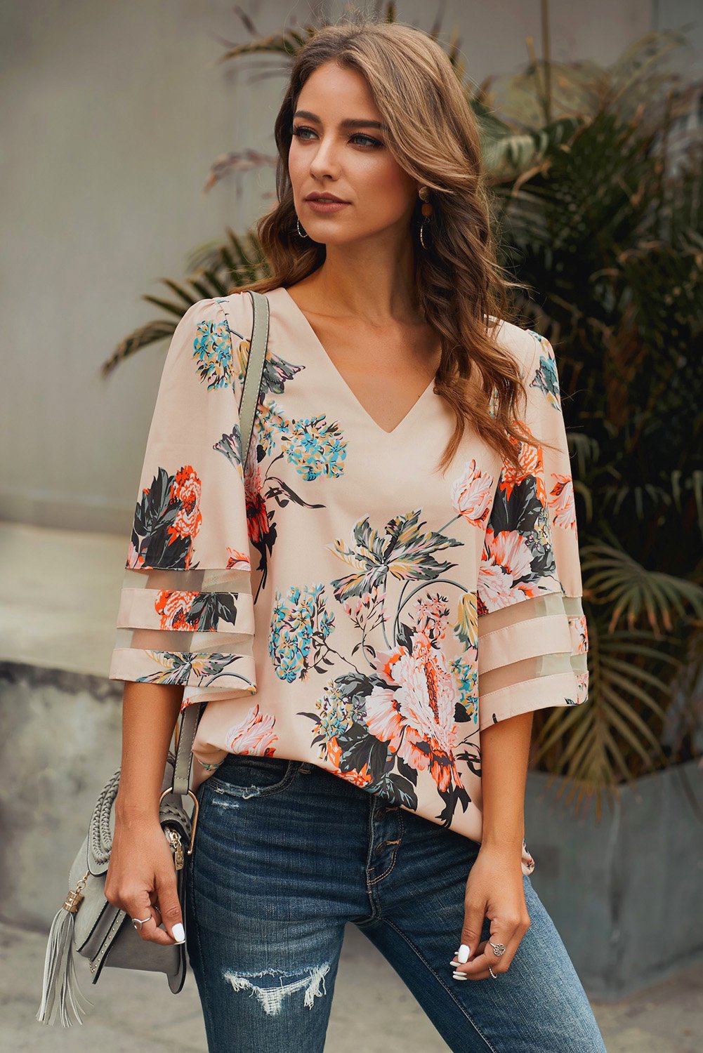 Apricot 3/4 flared sleeve floral chiffon blouse with v-neck and sheer patchwork sleeves, perfect for casual summer wear.