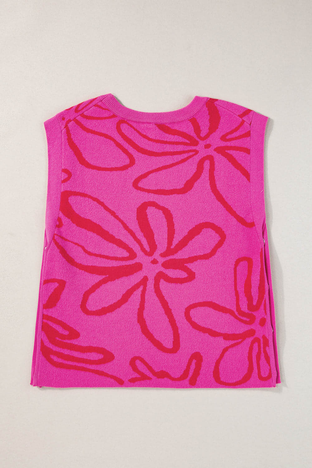 Bright Pink Button Sides Sleeveless Floral Knitted Top showcasing vibrant color and stylish button detailing.