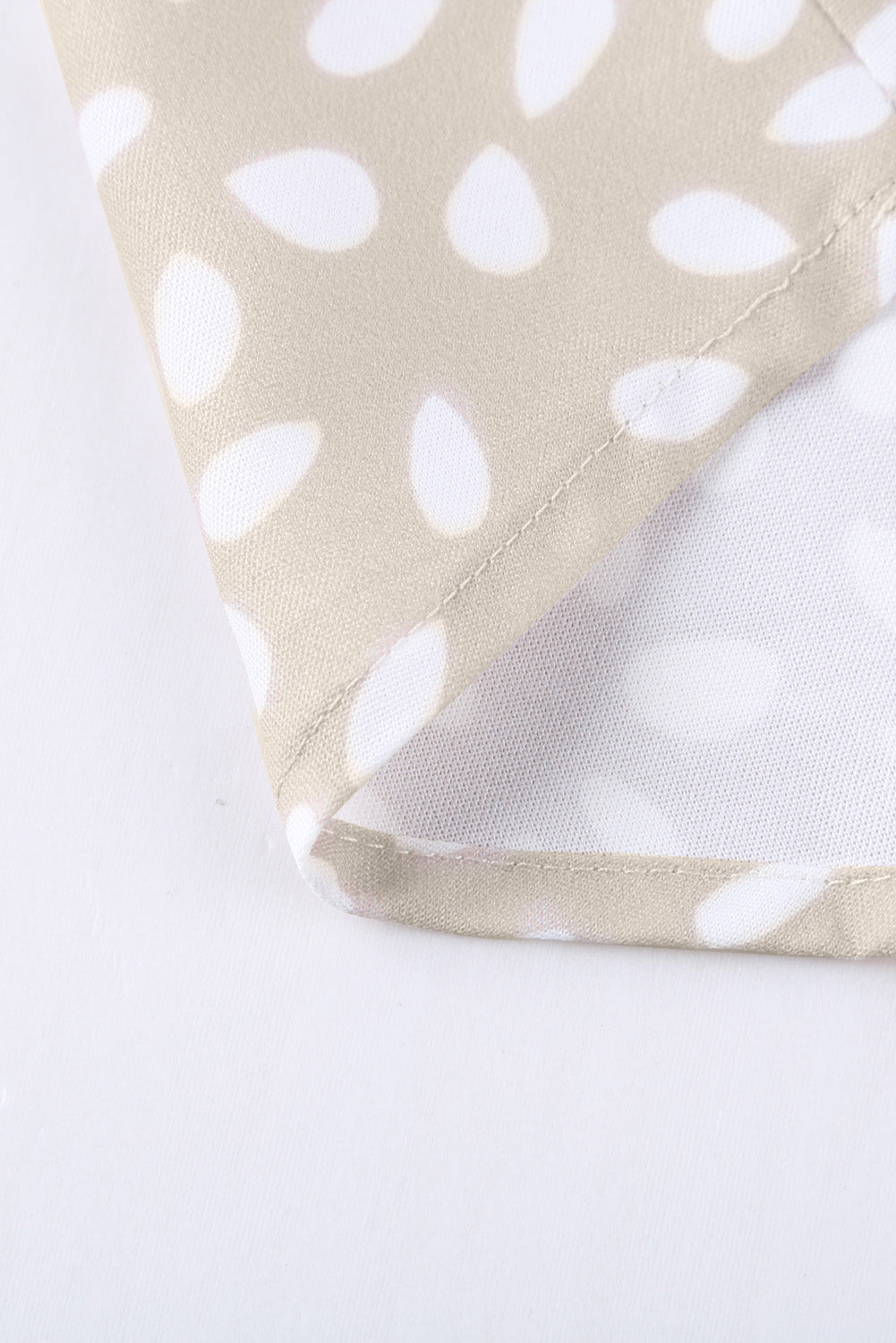 Chic Apricot Chloe Animal Print V-neck Tunic Top with rolled sleeves, featuring a stylish animal print design.