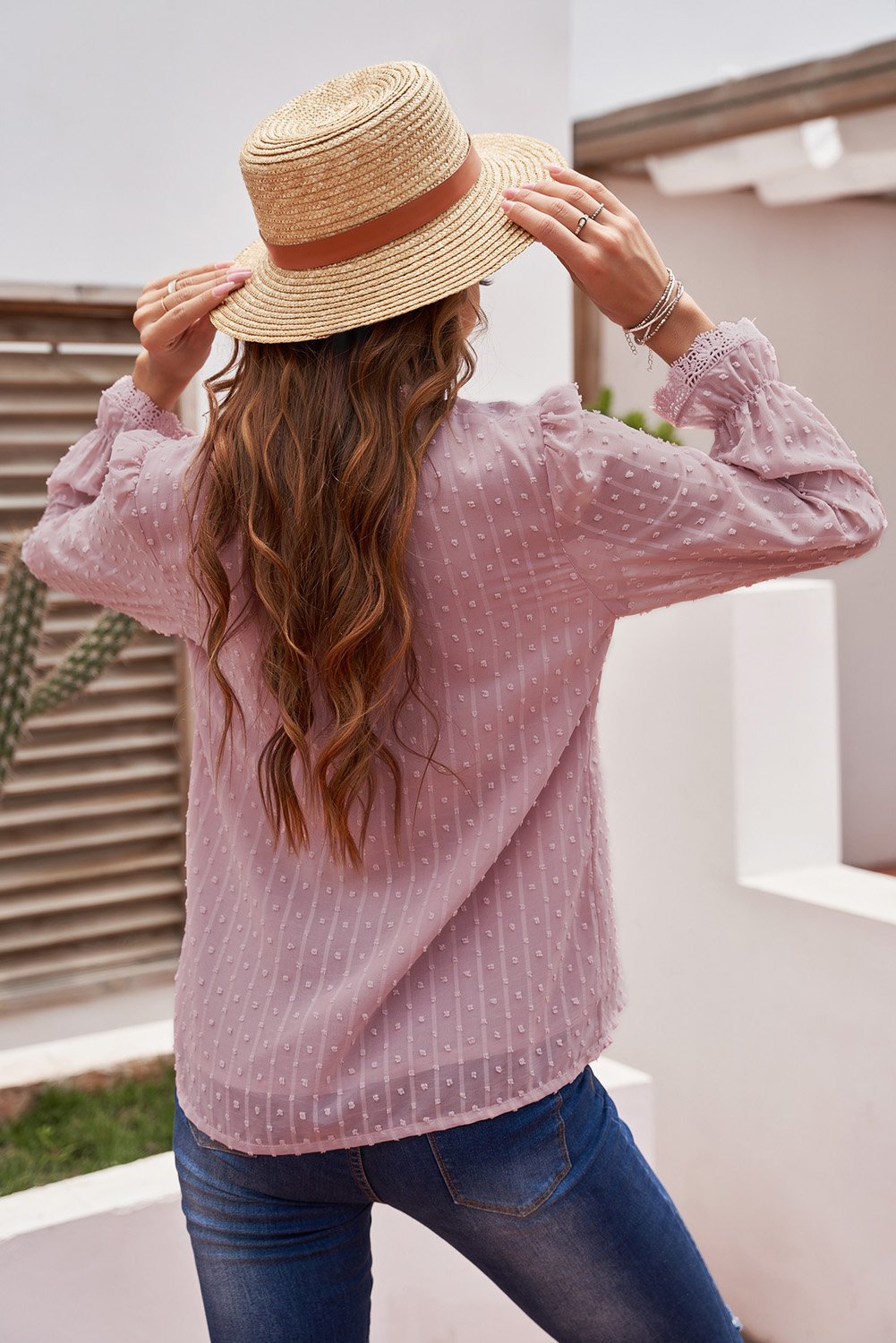 Chic pink long sleeve blouse featuring a v-neck and swiss dot lace details, perfect for casual and formal occasions.