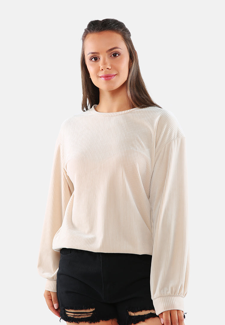 A cozy drop shoulder corduroy top featuring full sleeves and a relaxed fit, perfect for loungewear.
