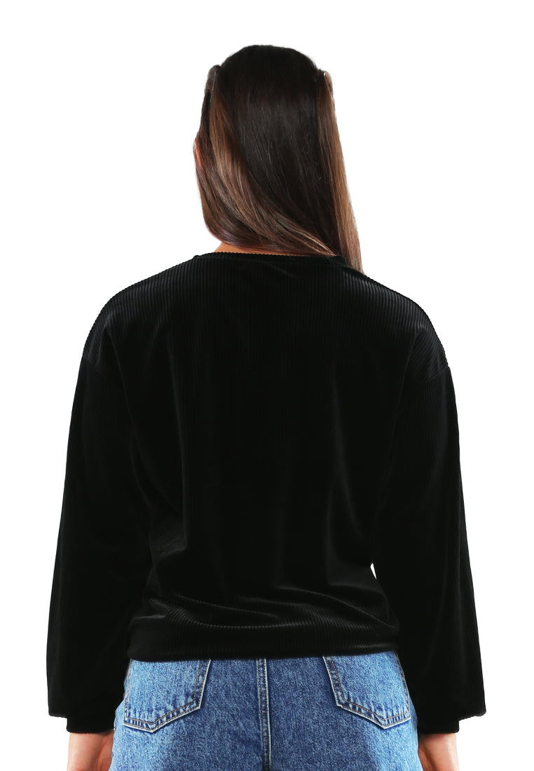 A cozy drop shoulder corduroy top featuring full sleeves and a relaxed fit, perfect for loungewear.
