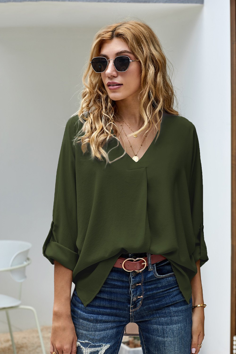 Elegant army green blouse with v-neck and 3/4 sleeves, featuring a high low hem design, perfect for casual wear.