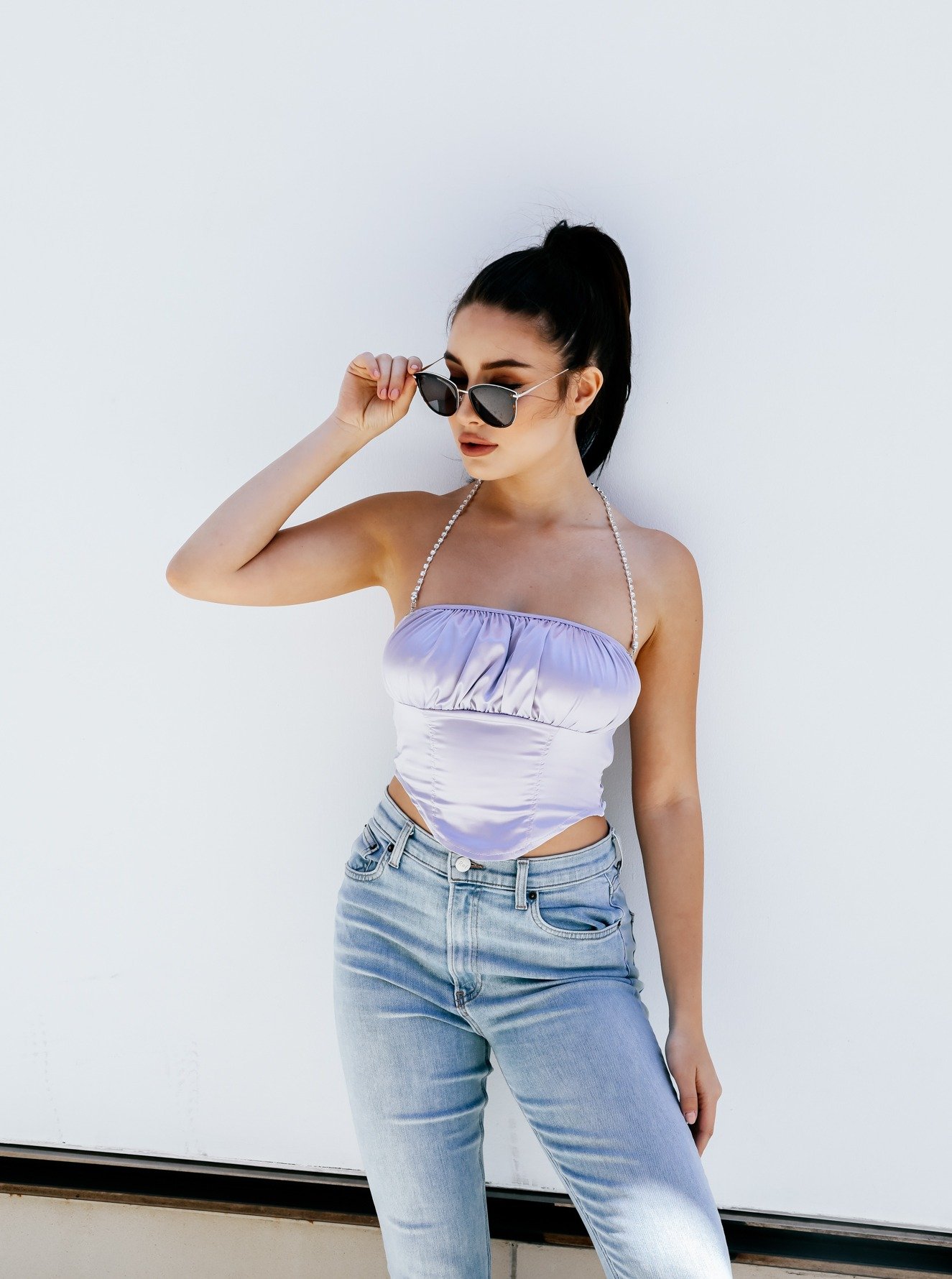 Let’s Dance Rhinestone Halter Top featuring a ruched bandeau bust, asymmetrical hems, and sparkling rhinestone-encrusted halter straps.