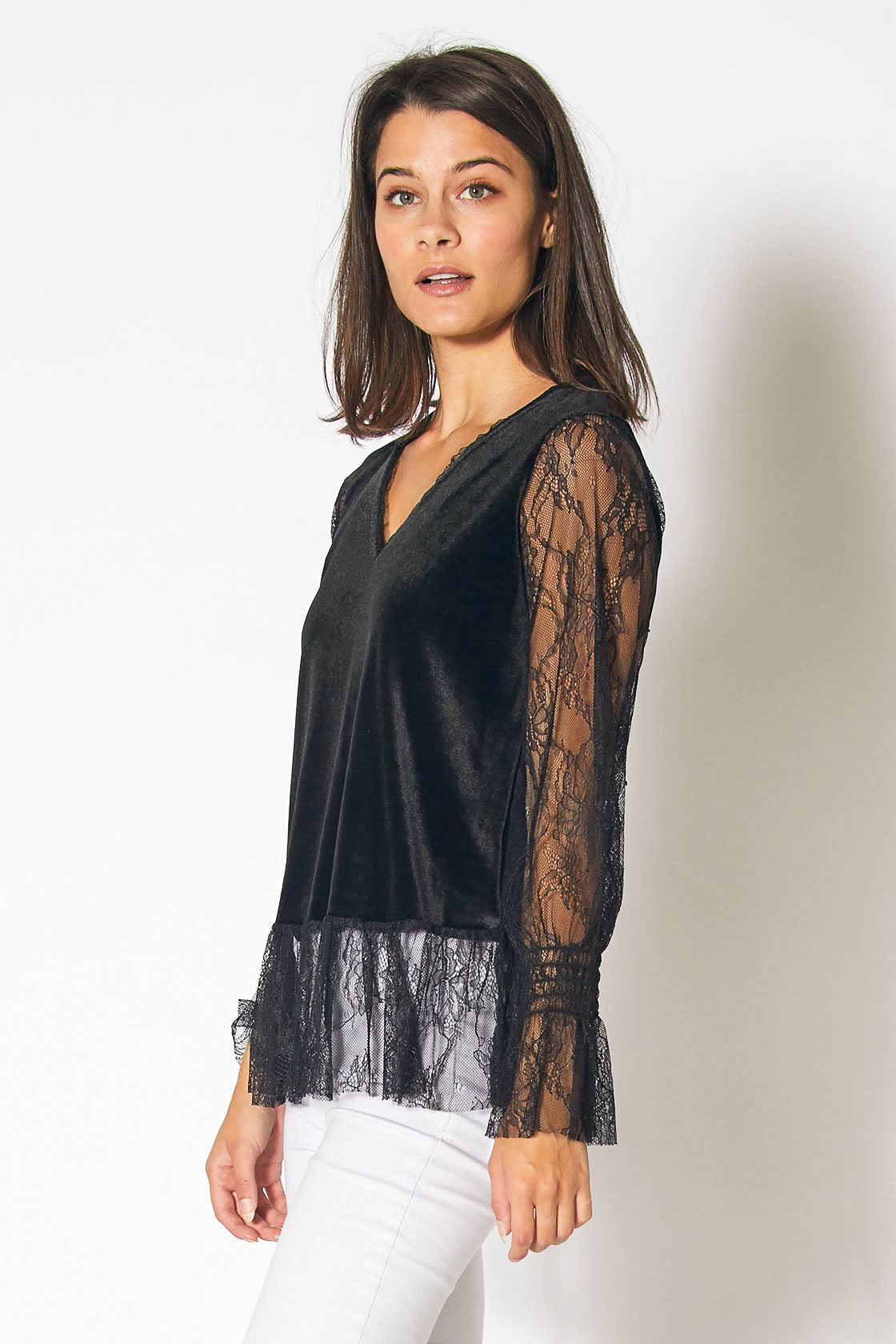 A stylish black long sleeve velvet top featuring elegant lace trim, perfect for any occasion.