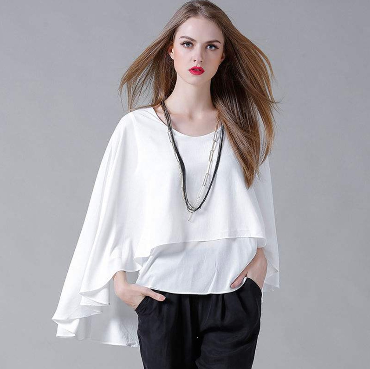 Women's Batwing Layered Chiffon Top in gray and white, showcasing its stylish batwing sleeves and layered design.