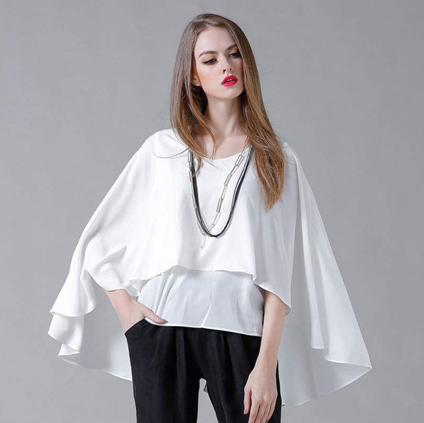 Women's Batwing Layered Chiffon Top in gray and white, showcasing its stylish batwing sleeves and layered design.