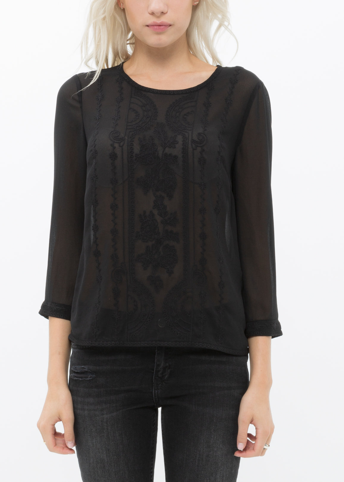 Women's black long sleeve sheer top with embossed front detail and lace panels.