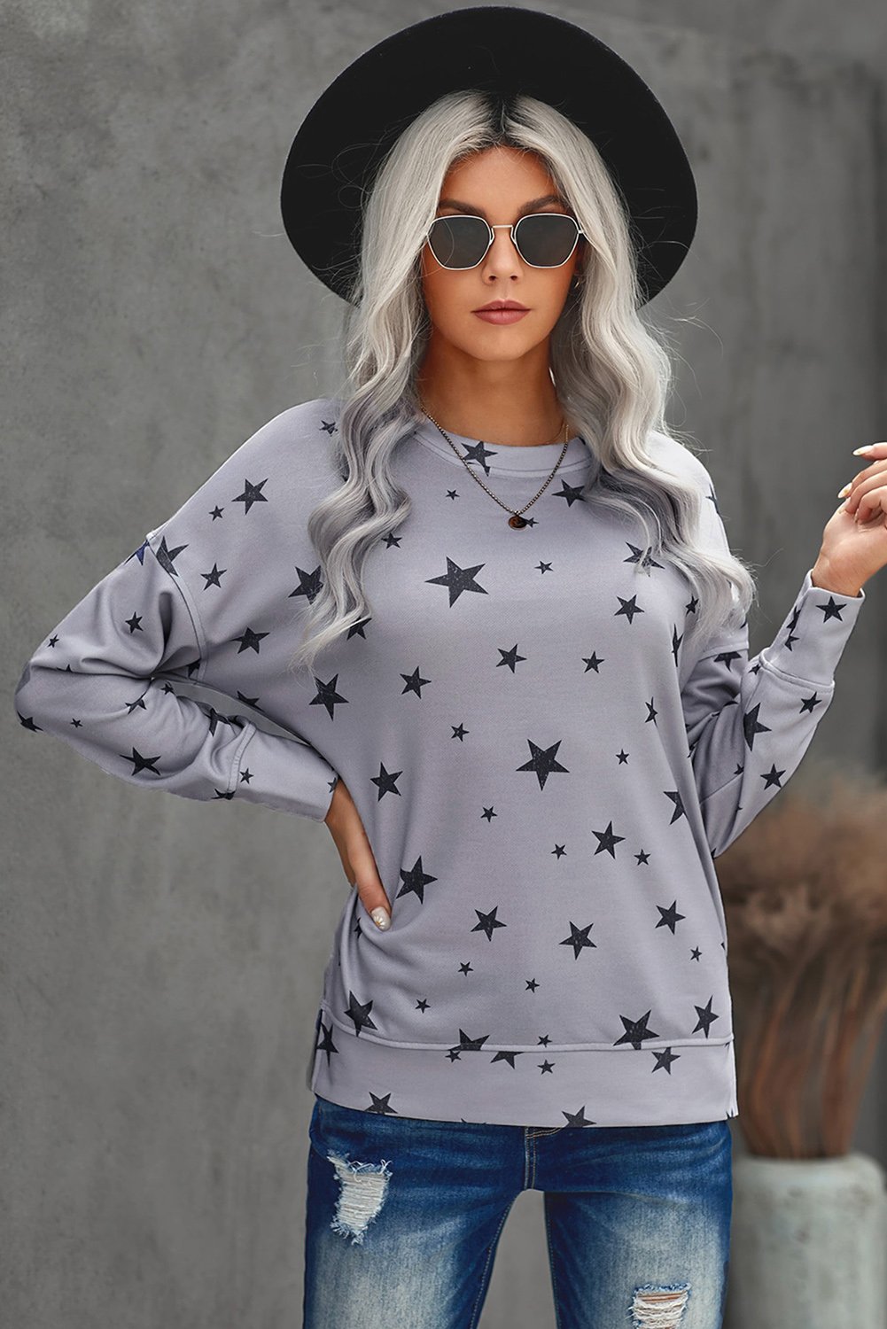 Women's gray long sleeve top featuring a stylish star print design, perfect for casual wear.
