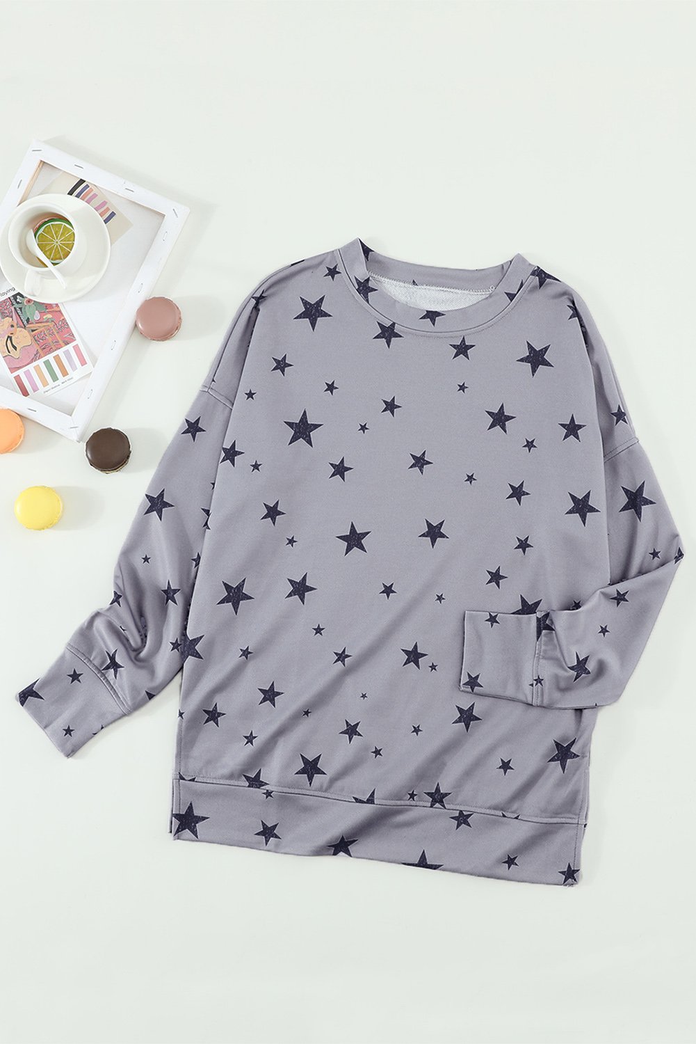 Women's gray long sleeve top featuring a stylish star print design, perfect for casual wear.