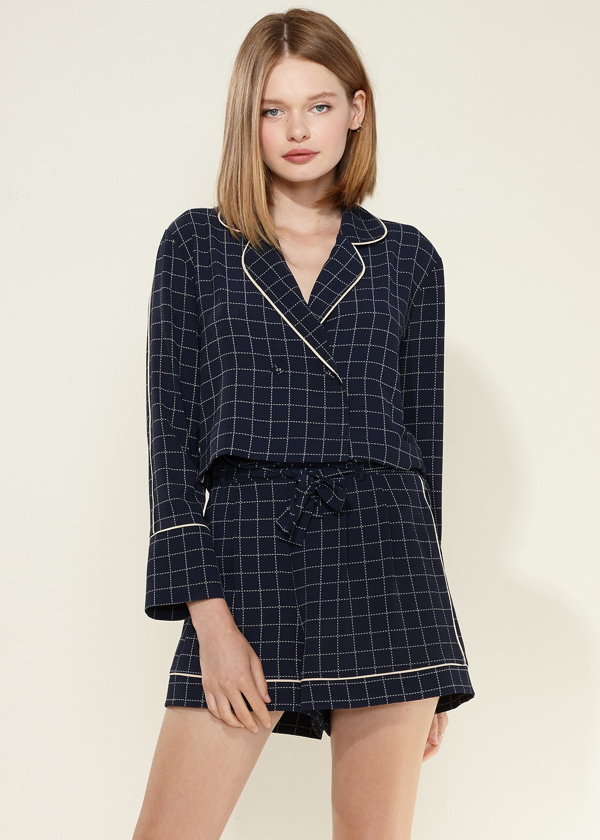 Women's navy plaid pajama blouse featuring a grid print design, made from soft polyester and spandex blend for comfort.