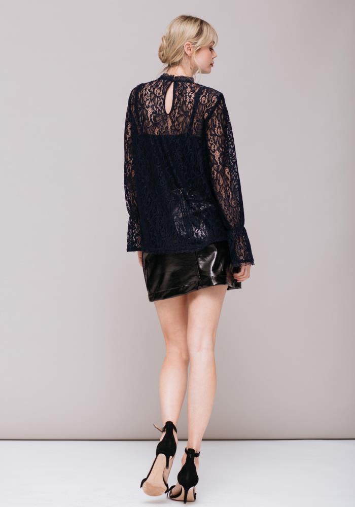 A stylish Women's Lace Turtle Neck Top featuring sheer lace fabric and a high neck design, perfect for layering and holiday outfits.