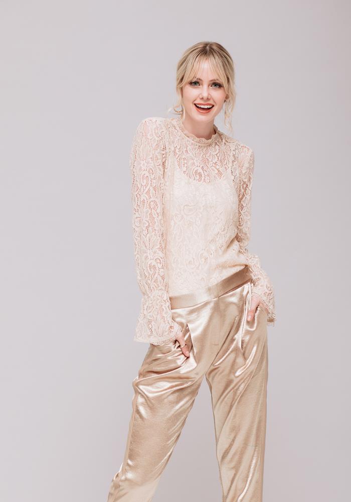 A stylish Women's Lace Turtle Neck Top featuring sheer lace fabric and a high neck design, perfect for layering and holiday outfits.