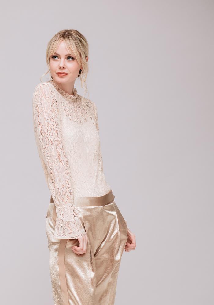 A stylish Women's Lace Turtle Neck Top featuring sheer lace fabric and a high neck design, perfect for layering and holiday outfits.