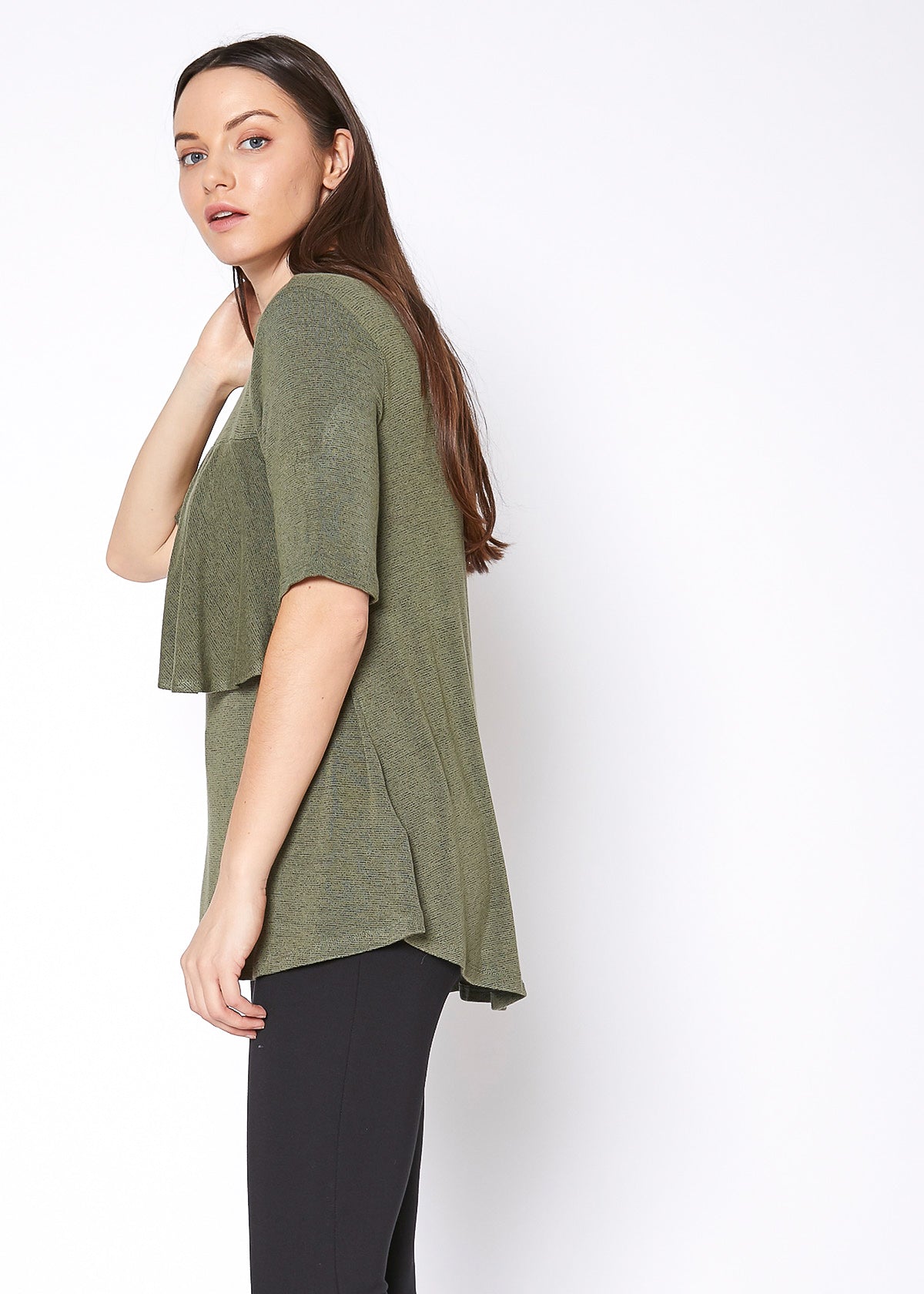 Women's mock neck short sleeve top with ruffled yoke and button closure, showcasing a stylish and elegant design.