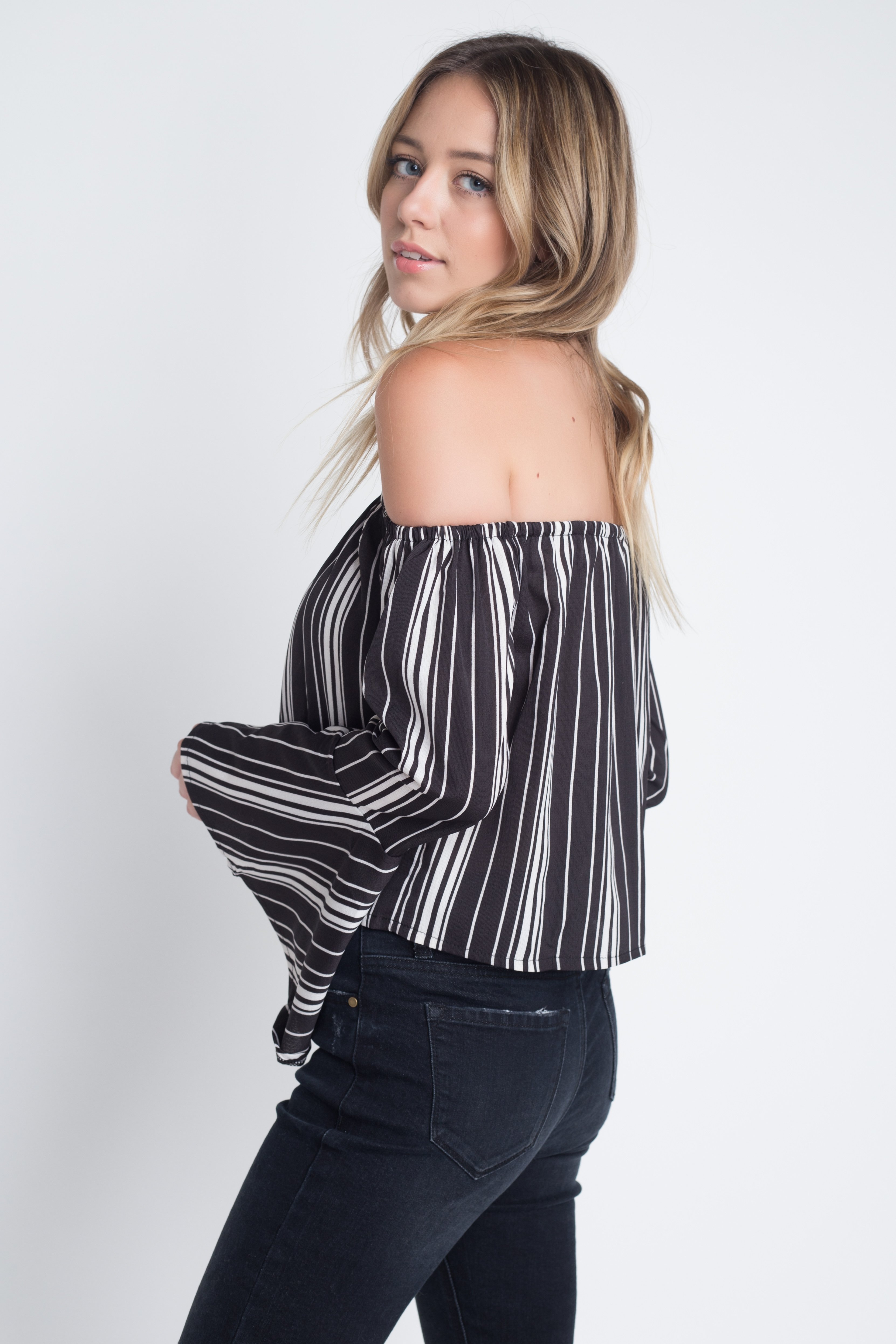 A stylish Women's Off Shoulder Casual Stripe Bell Sleeve Top featuring a trendy stripe print and elegant bell sleeves, perfect for casual outings.