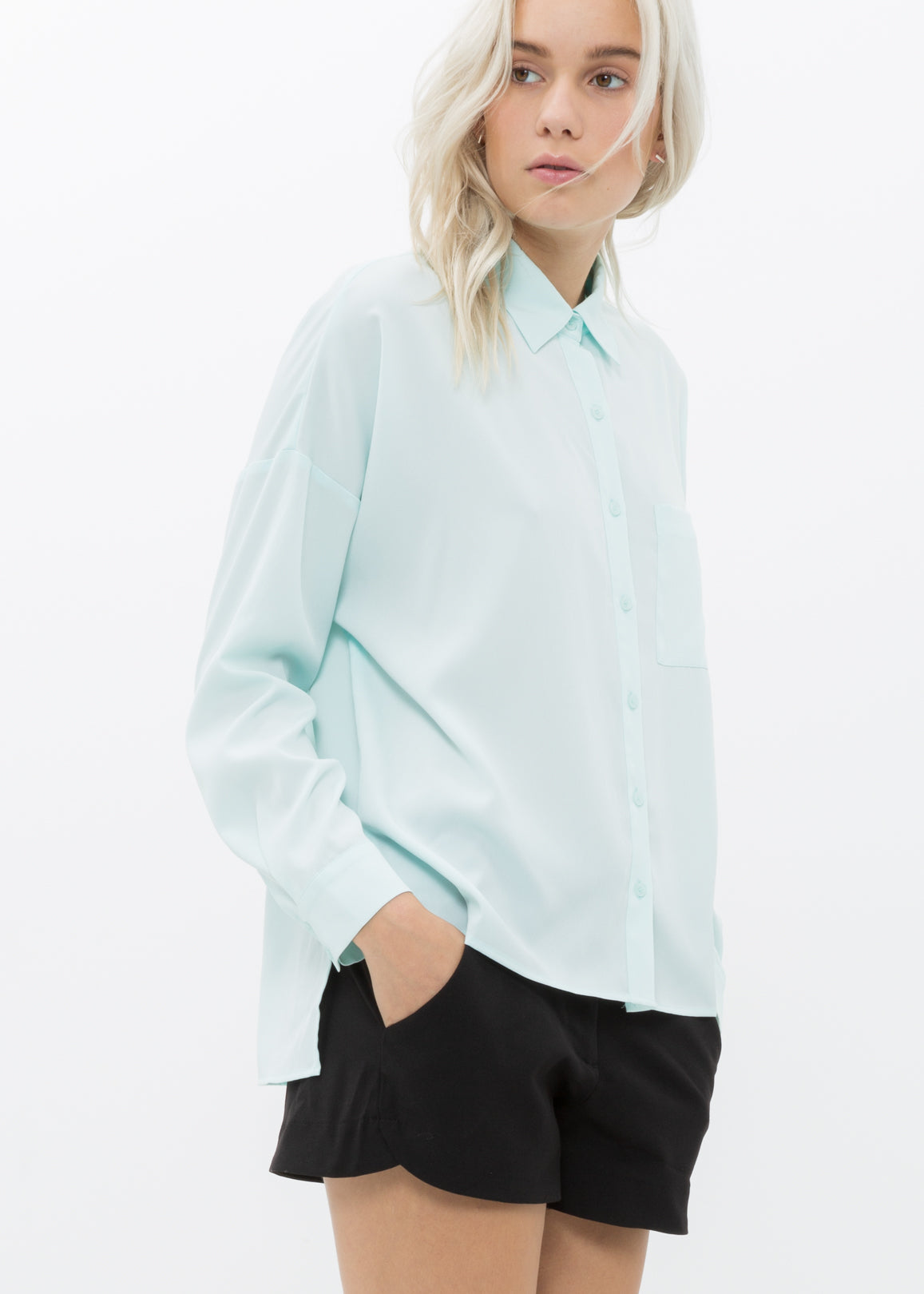 Women's Printed Shirt Blouse in Peppermint featuring a drop shoulder style, hi-lo hem, and long sleeves with double button cuffs.