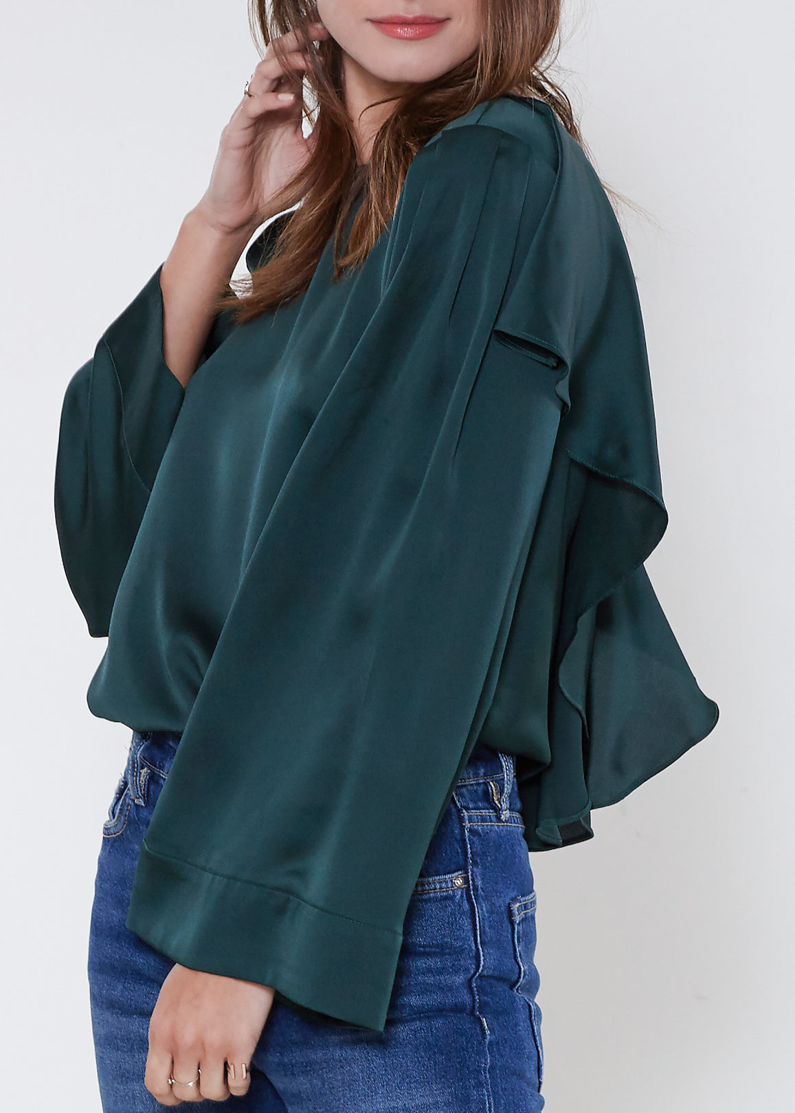 A stylish Women's Ruffle Back Sleeve Top featuring elegant ruffles on the back, made from soft polyester fabric.