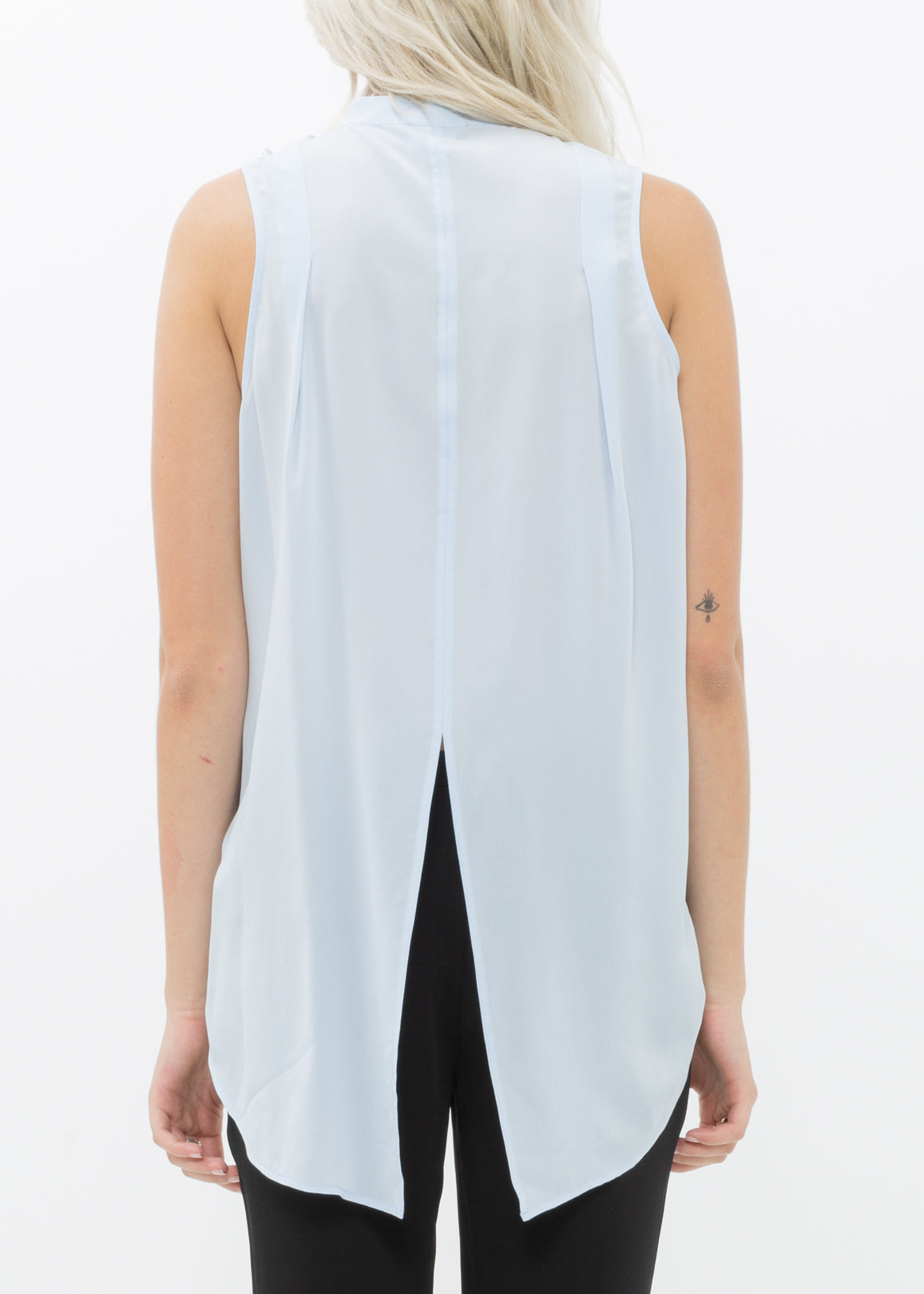 A stylish women's sleeveless mock neck sheer blouse made of 100% silk, featuring a button closure and elegant design.