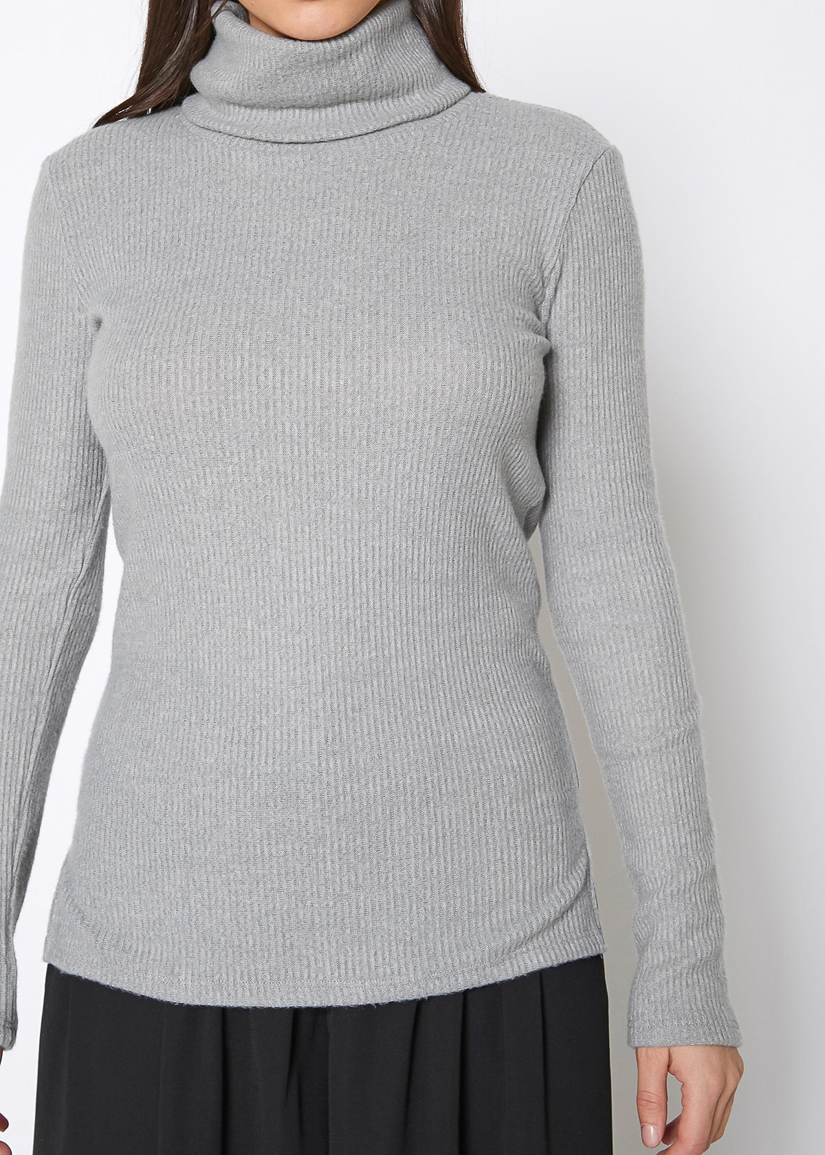 A stylish Women's Soft Turtle Neck Ribbed Knit Sweater Top in a cozy ribbed knit fabric, perfect for casual wear.