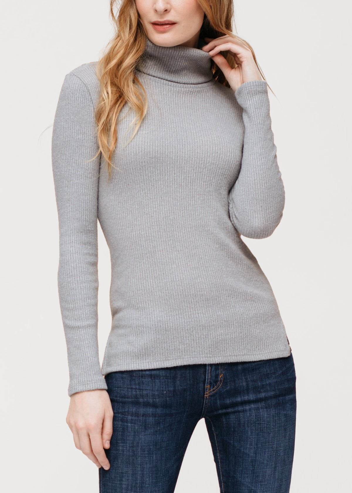 A stylish Women's Soft Turtle Neck Ribbed Knit Sweater Top in a cozy ribbed knit fabric, perfect for casual wear.