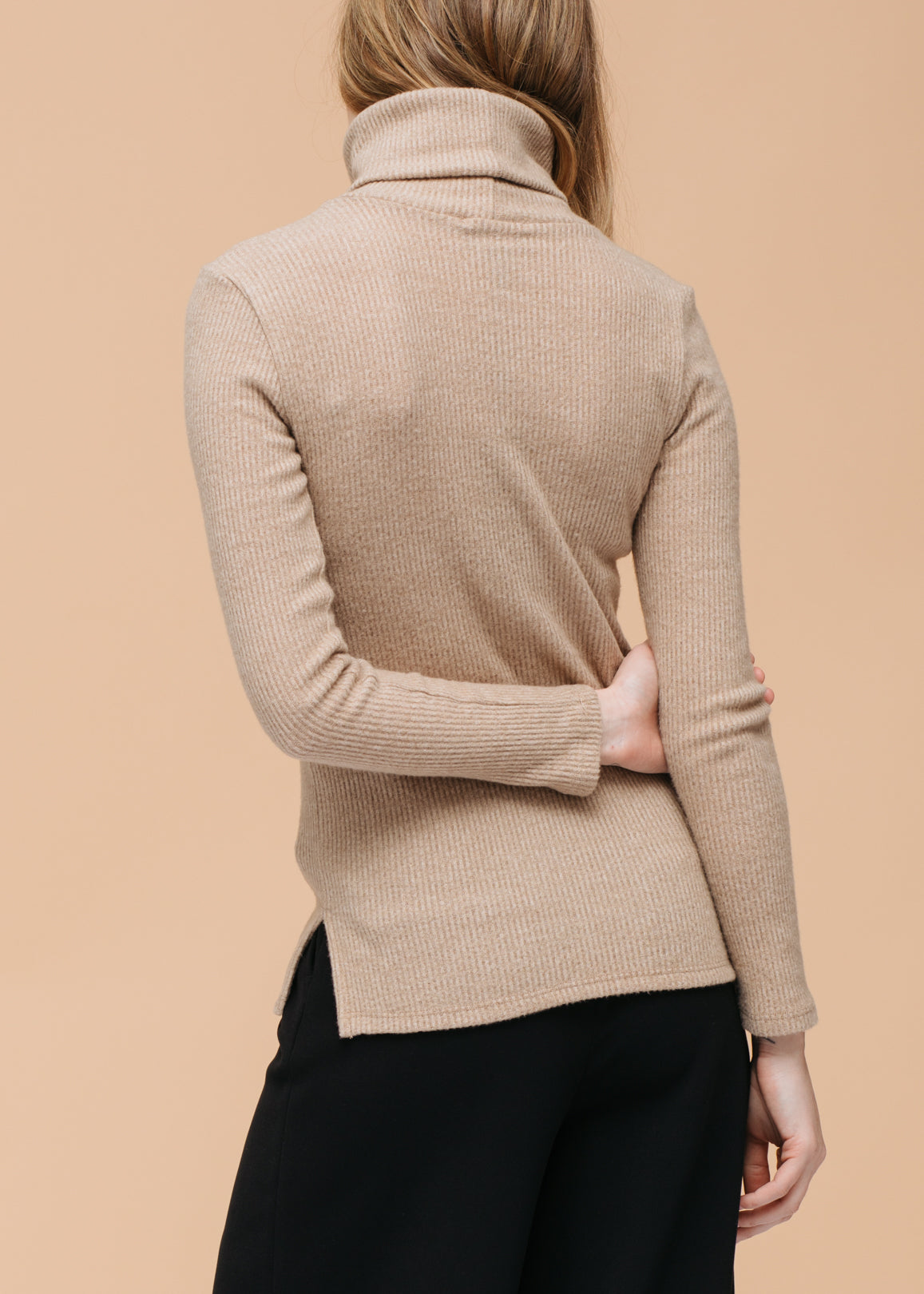 A stylish Women's Soft Turtle Neck Ribbed Knit Sweater Top in a cozy ribbed knit fabric, perfect for casual wear.