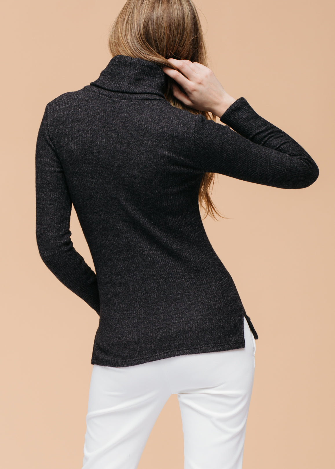 A stylish Women's Soft Turtle Neck Ribbed Knit Sweater Top in a cozy ribbed knit fabric, perfect for casual wear.