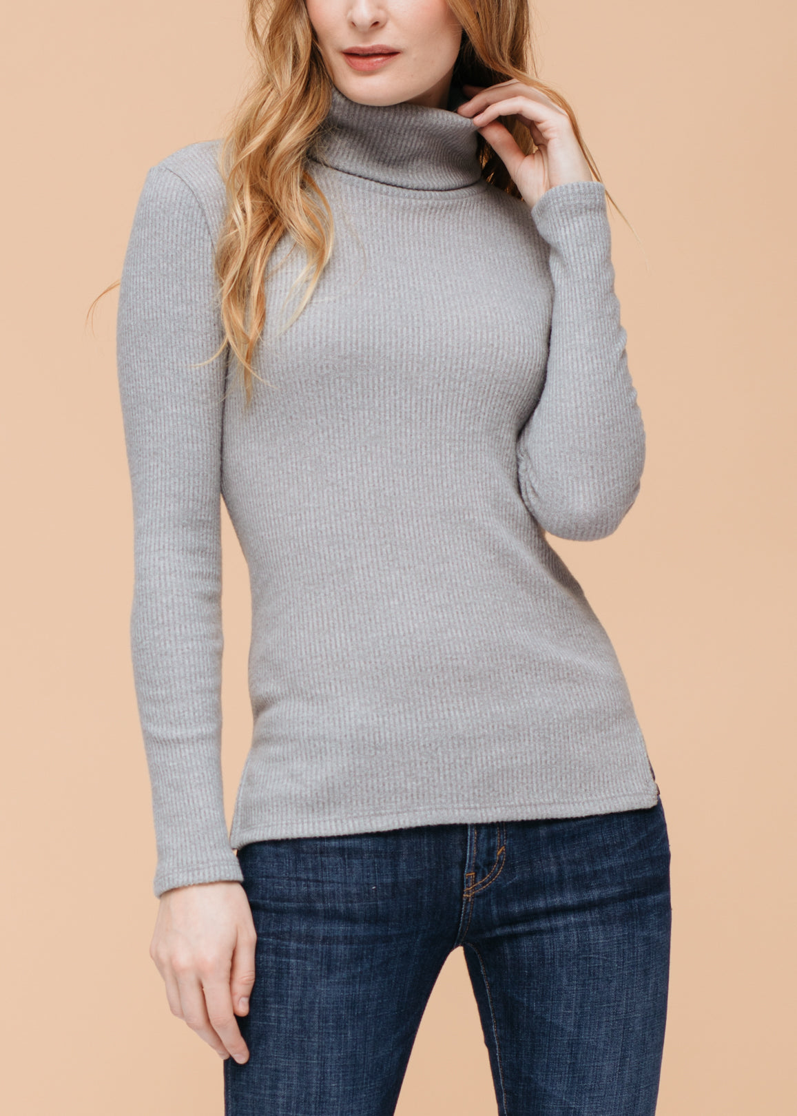 A stylish Women's Soft Turtle Neck Ribbed Knit Sweater Top in a cozy ribbed knit fabric, perfect for casual wear.