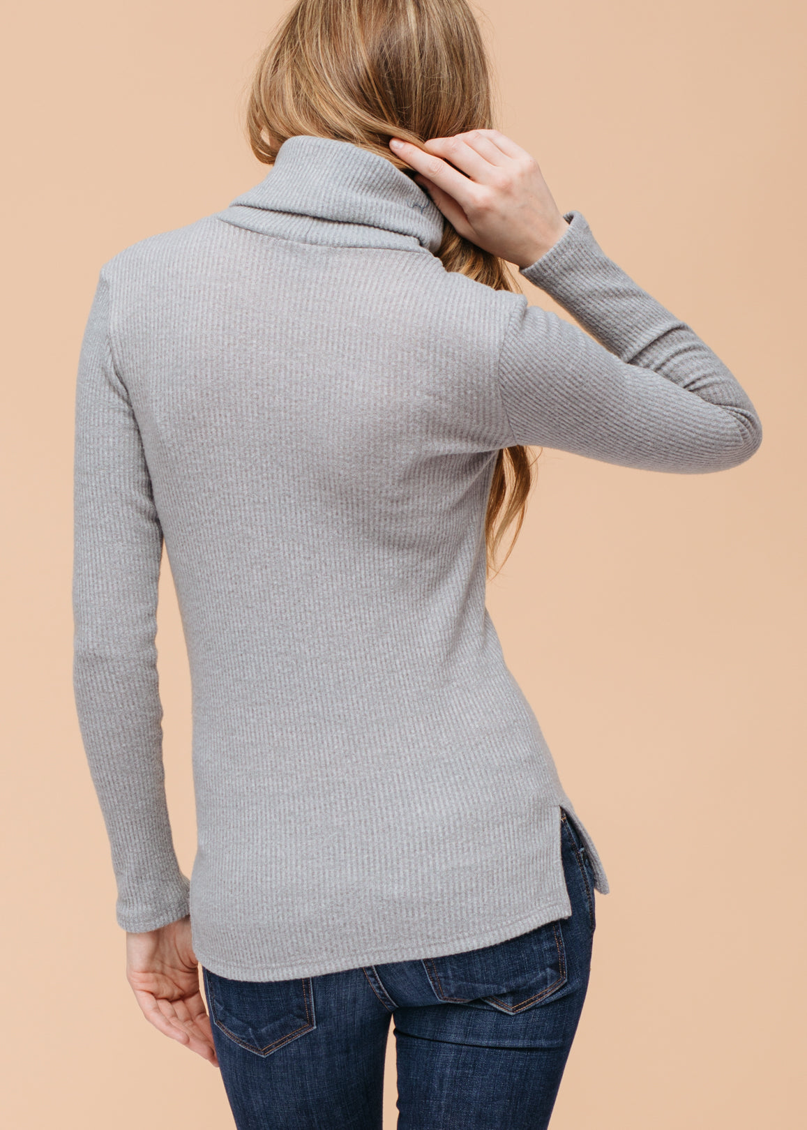 A stylish Women's Soft Turtle Neck Ribbed Knit Sweater Top in a cozy ribbed knit fabric, perfect for casual wear.