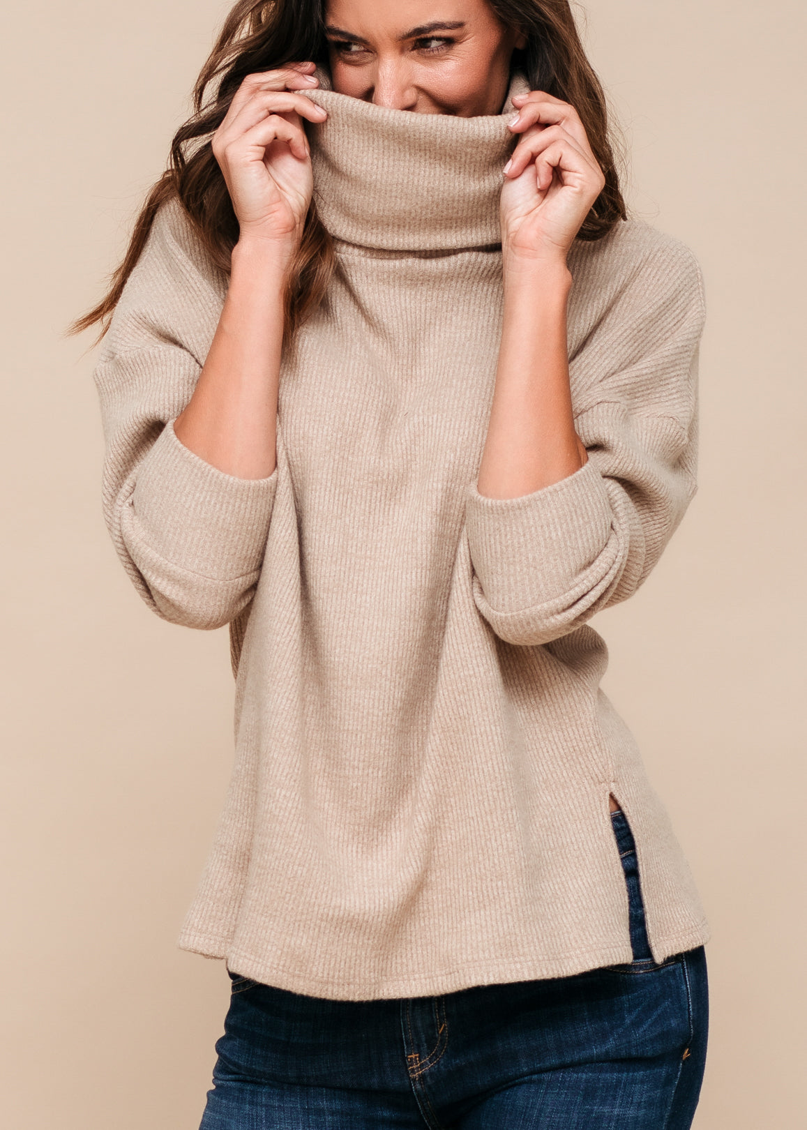 A stylish Women's Turtle Neck Ribbed Oversize Sweater Top in a cozy fit, showcasing its ribbed texture and turtle neck design.