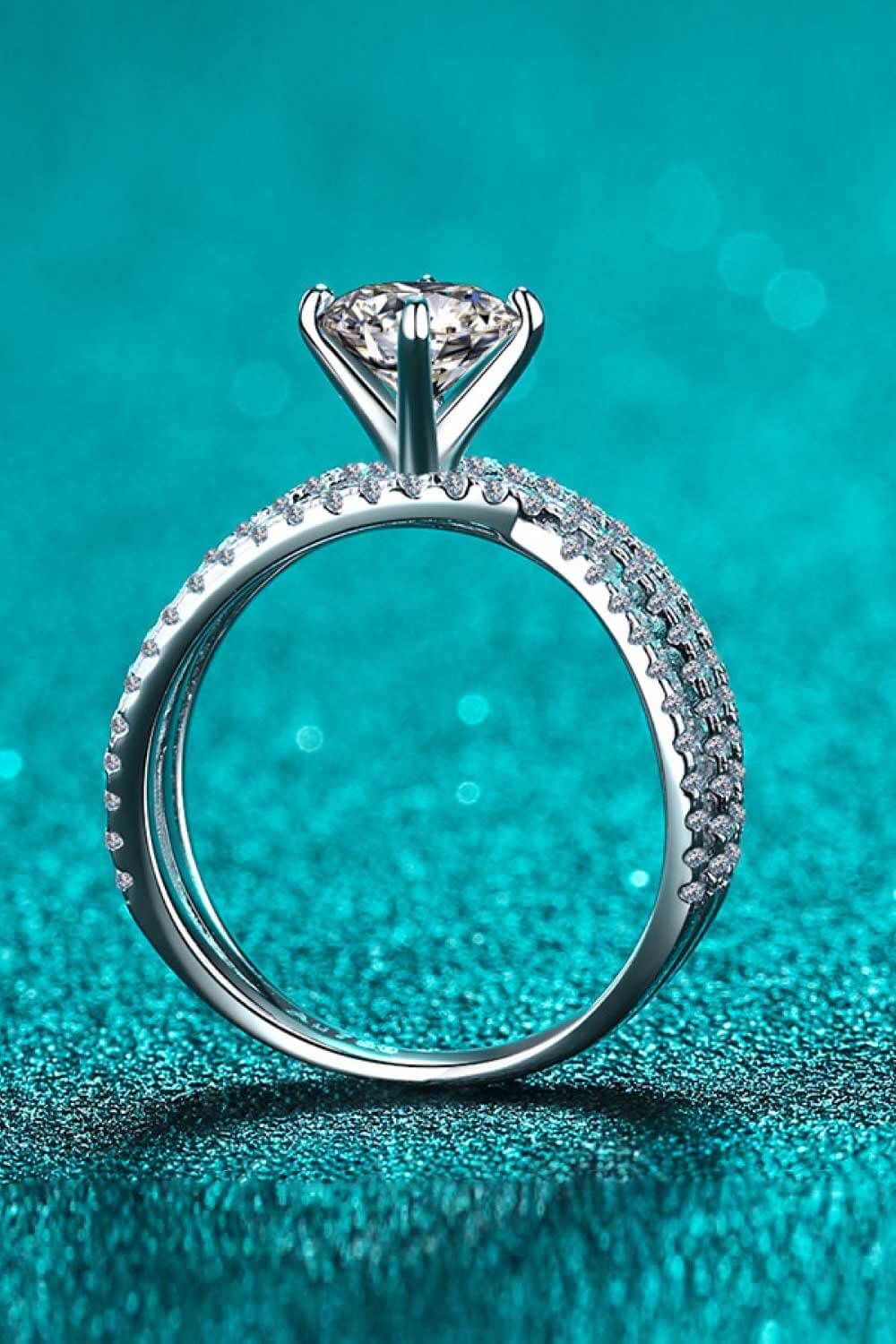 1 Carat Moissanite Crisscross Ring in 925 sterling silver with rhinestone accents, showcasing its elegant design.