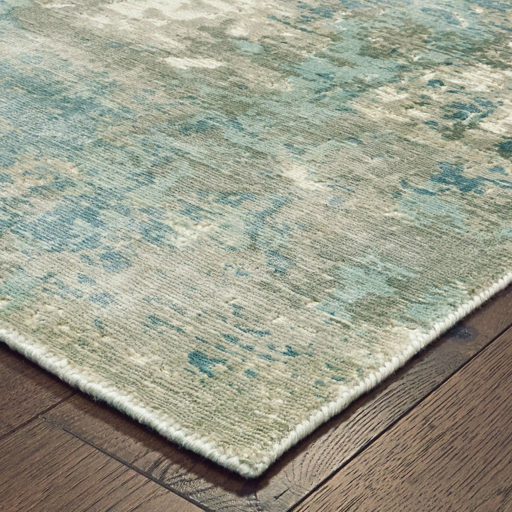 10x14 Blue and Gray Abstract Pattern Indoor Area Rug showcasing a calming pastel palette with a soft texture.