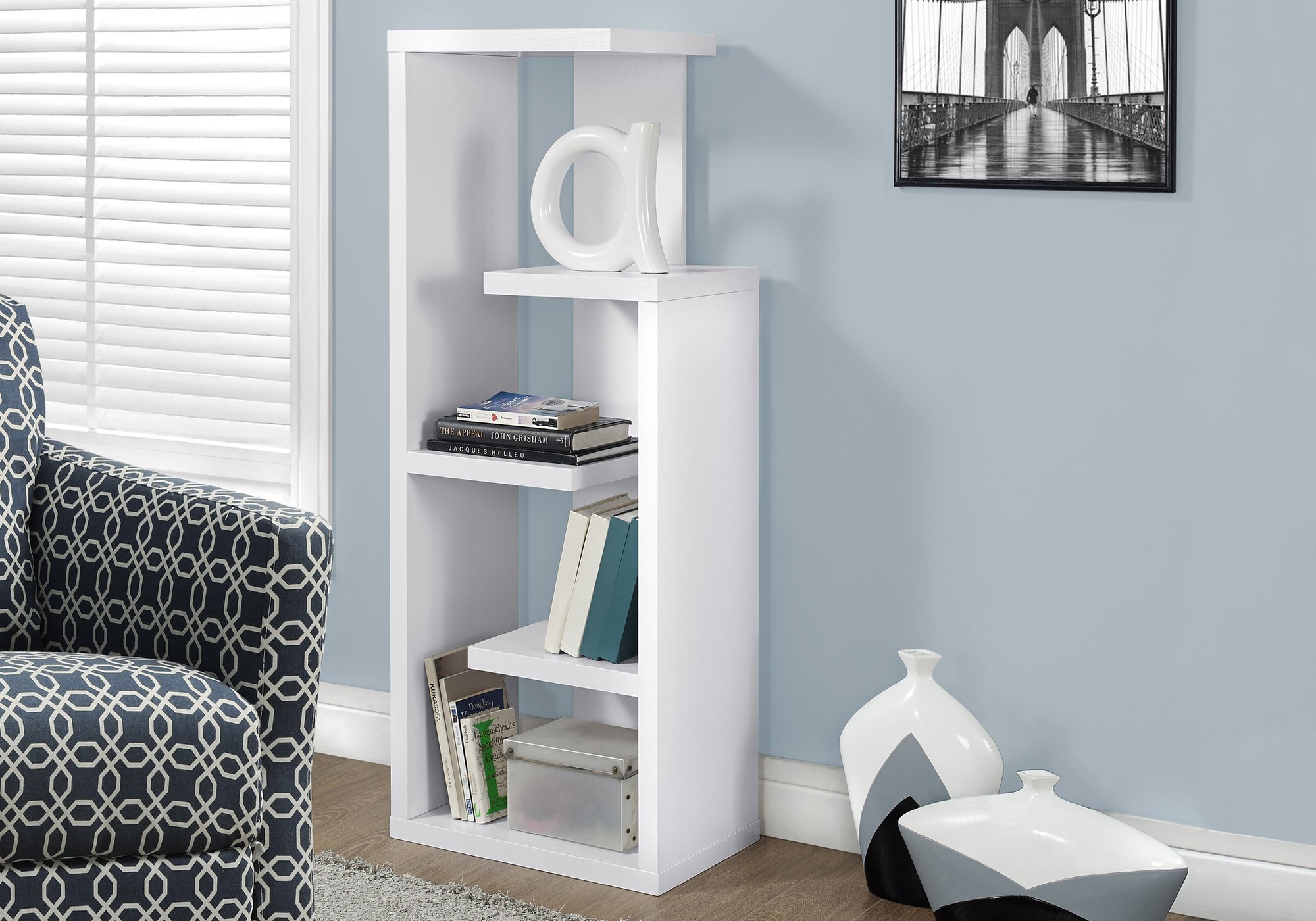 A modern white particle board bookcase with five open shelves, perfect for displaying books and decorative items.