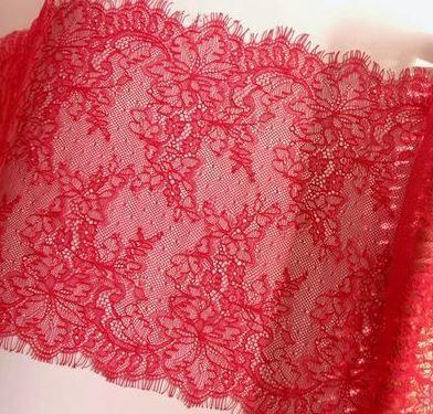 1/2 yard of red double edge eyelash Chantilly lace, showcasing intricate patterns and soft texture, perfect for crafting and fashion projects.