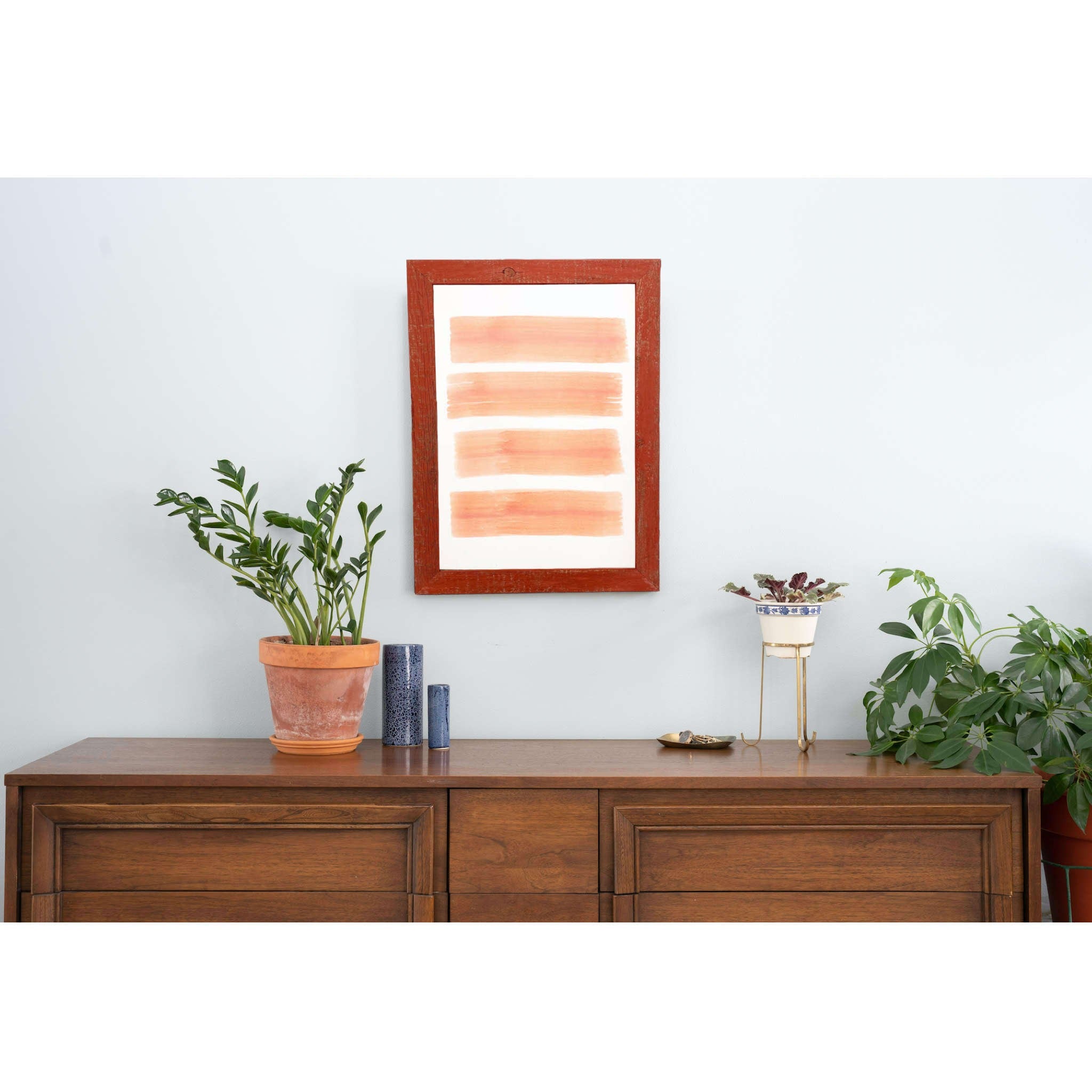 A rustic farmhouse red wood frame measuring 12x12 inches, showcasing natural wood knots and blemishes, perfect for displaying photos.