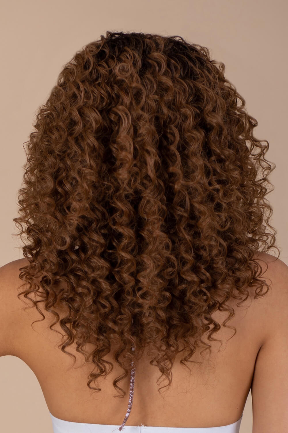 A stunning 13*2'' lace front wig featuring long, curly synthetic hair with a natural look and 150% density.