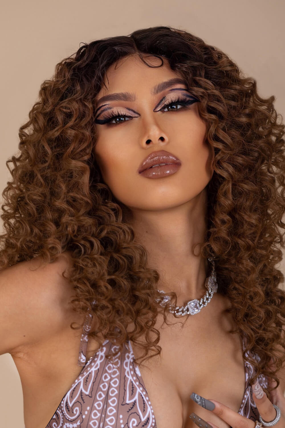 A stunning 13*2'' lace front wig featuring long, curly synthetic hair with a natural look and 150% density.