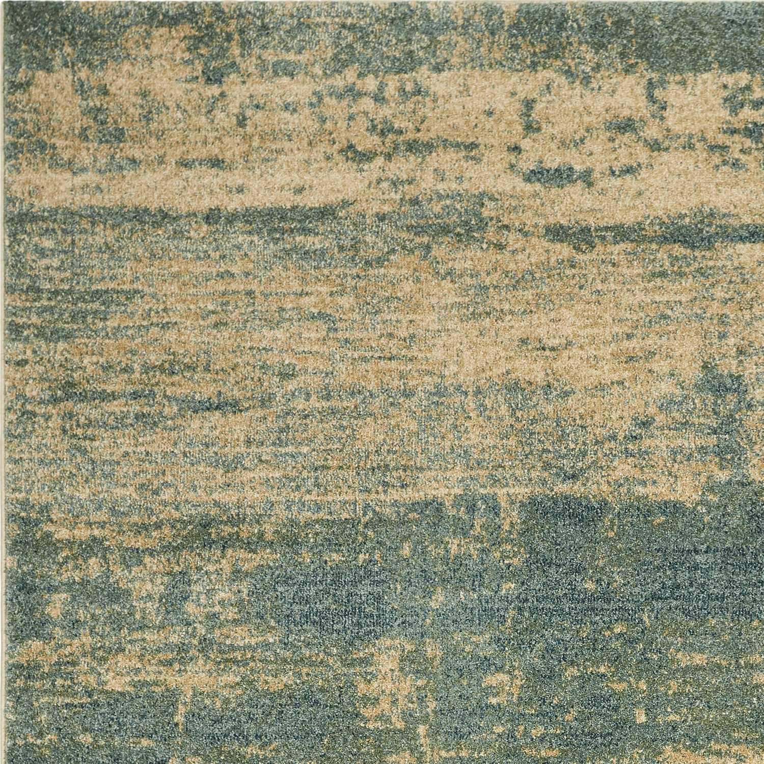 A large 118" x 158" seafoam polypropylene rug featuring a vintage traditional design with distressed touches, perfect for enhancing home decor.